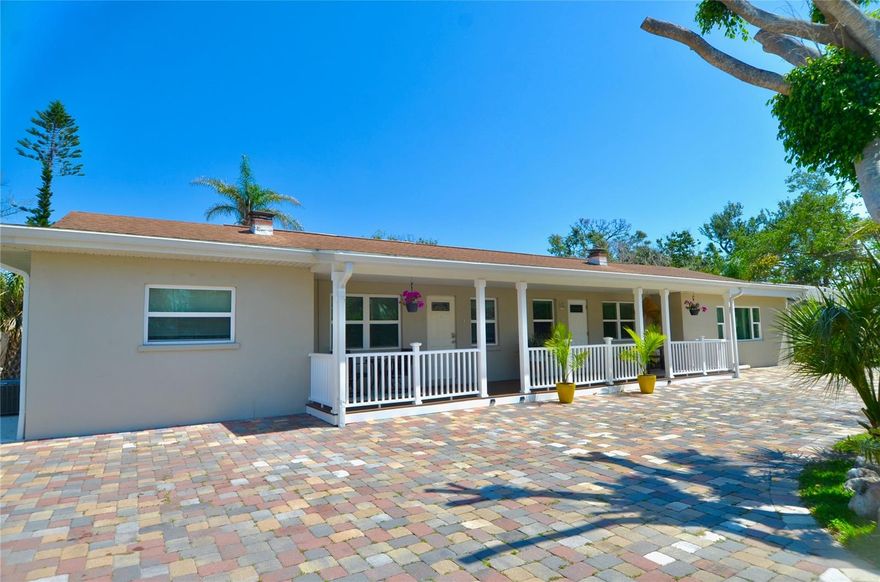 Spacious Duplex Over 2,800 Square Feet in Nokomis, FL! Discover a rare opportunity for multi-generational living or investment with this expansive duplex, offering over 2,800 square feet of living space on a .33-acre lot. With 5 bedrooms and 3 bathrooms split between two separate residences—Unit A (2 bed, 1 bath) and Unit B (3 bed, 2 bath)—this property delivers outstanding versatility and value. A large circular paver driveway welcomes you with ample parking, while a shared covered front porch creates a warm and inviting entry for both homes. Each unit enjoys its own private mailbox and fenced backyard, ensuring privacy and comfort for residents or guests alike. Unit A opens to a bright kitchen and dining area, featuring stainless steel appliances, raised-panel wood cabinetry, and gray quartz countertops. A cozy living room with tongue-and-groove ceiling details and crown molding flows seamlessly into the primary bedroom, while the second bedroom and updated full bath with walk-in shower sit conveniently off the kitchen. Tile flooring runs throughout the unit, and a bonus rear room provides access to a covered porch and private fenced yard—perfect for relaxing or entertaining. Unit B, the larger of the two, offers a split-bedroom layout and an inviting sense of space. The recently updated kitchen is equipped with stainless steel appliances, white raised-panel cabinetry, gray quartz countertops, new subway tile backsplash, recessed lighting, new porcelain tile flooring, and a cozy dinette with coffee bar or beverage station. Off the kitchen, you’ll find a full bathroom with a walk-in shower and a guest bedroom with built-in closet. The open living and dining area is the heart of the home, highlighted by an impressive floor-to-ceiling decorative stone fireplace and abundant natural light from multiple windows. The second bedroom includes backyard access through sliding glass doors, while the primary suite features a walk-in closet, recessed lighting, and private outdoor access as well. The updated second bathroom includes a dual sink vanity and a spacious walk-in shower. Additional features of Unit B include a laundry closet, a private side entrance, and an expansive backyard complete with a patio, firepit, and raised wood deck—ideal for gatherings and Florida evenings. Located just minutes from Nokomis Beach, Venice Island, Legacy Trail, I-75, Sarasota Memorial Hospital – Venice, and an array of shops, restaurants, parks, and golf courses, this property offers both convenience and lifestyle appeal. Whether you’re seeking income-producing potential, a live-in-one-rent-the-other setup, or space to accommodate extended family, this duplex provides endless possibilities. Don’t miss this incredible opportunity to own a versatile property in one of Nokomis’ most desirable locations!