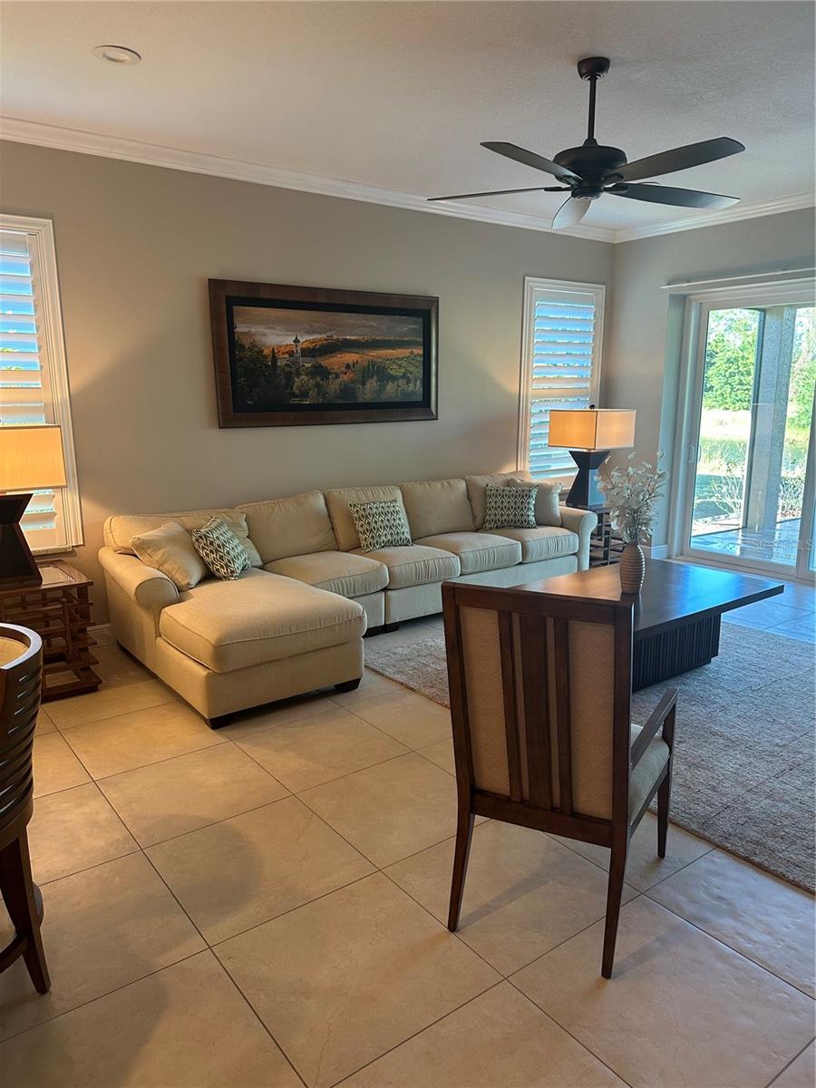 Welcome to this charming, maintenance free home located in the desirable University Park Country Club. This 2-bedroom, 2-bathroom, plus den residence boasts a spacious 2,208 square feet of living space. Upon entering you are greeted with an abundance of natural light that creates a warm and welcoming ambiance. The open floor plan allows for seamless flow between the living, dining, and kitchen areas, perfect for entertaining. The oversized primary bedroom provides a peaceful retreat with a private en-suite bathroom. The home includes a guest bedroom which offers privacy and comfort for your visitors. Additionally the large den provides an ideal home office, media room, or creative space. The property's prime location offers convenient access to a variety of local amenities, ensuring a lifestyle of ease.