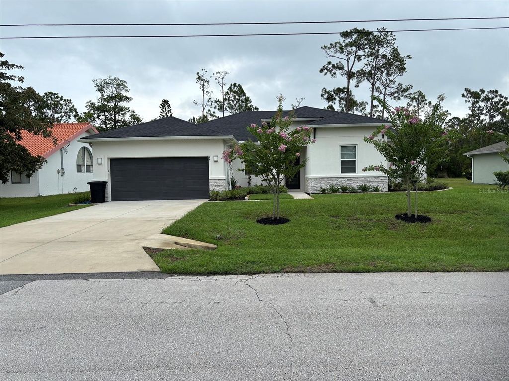 Photo of 44 Boulder Rock Drive, Palm Coast, FL 32137 (MLS # FC310967)