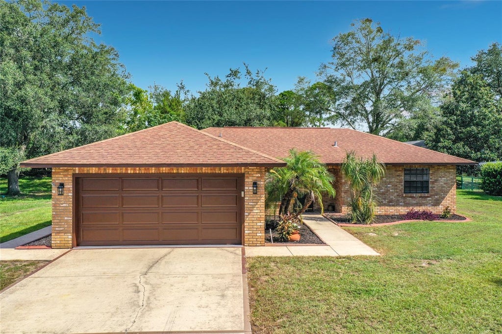 Photo of 12505 Wedgefield Drive, Grand Island, FL 32735 (MLS # O6439260)