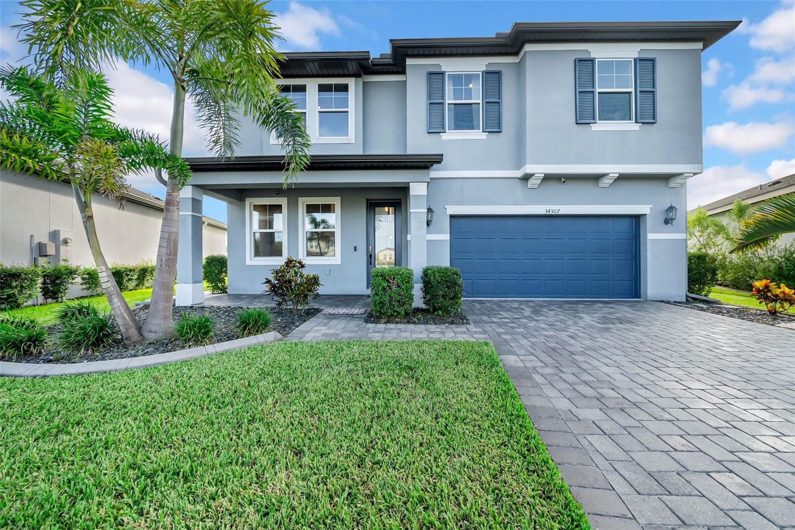 Step into this modern, move-in ready home located in the highly desirable Watergrass community of Wesley Chapel, tucked away on a quiet cul-de-sac with a tranquil pond and conservation views. Offering 2,600 sq. ft. of living space, this 4-bedroom, 2.5-bath residence includes a versatile loft and dedicated office/playroom—perfect for today’s lifestyle. At the heart of the home, the open-concept kitchen and family room create a warm, inviting space for both everyday living and entertaining. The kitchen shines with quartz countertops, a marble backsplash, and a spacious center island ideal for gatherings. Newly installed LVP flooring flows throughout, adding a fresh and stylish touch. Outside, a screened-in lanai and large fenced in backyard provide a serene setting for outdoor dining, barbecues, or simply relaxing under the beautiful Wesley Chapel skies. Watergrass offers resort-style amenities including three pools (a lap pool, a zero entry pool, a third community pool), tennis courts, fitness center, a pavilion, and numerous playgrounds with one located within the neighborhood—giving you the perfect blend of luxury, lifestyle, and location. Convenience is unmatched with I-75 just minutes away and everyday essentials like Publix and Starbucks just down the street. The location offers many school choices, including Watergrass Elementary, Kirkland Ranch Academy of Innovation, and Innovation Preparatory Academy, which are just moments away. The home’s prime location also offers easy access to Tampa Premium Outlets, Wiregrass Mall, KRATE at the Grove, top hospitals, and an array of dining and retail options.