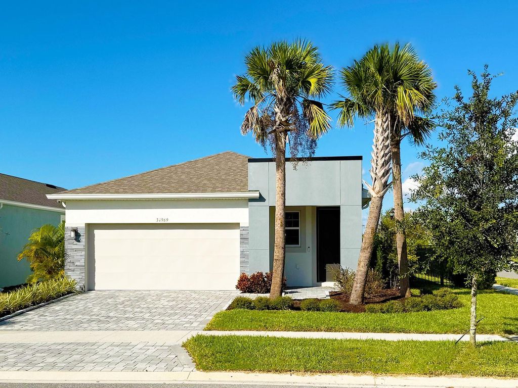 Photo of 31969 Asbury Avenue, Wesley Chapel, FL 33545 (MLS # O6361160)