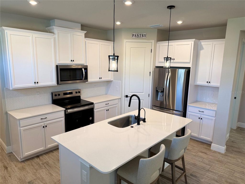 Photo of 31969 Asbury Avenue, Wesley Chapel, FL 33545 (MLS # O6361160)