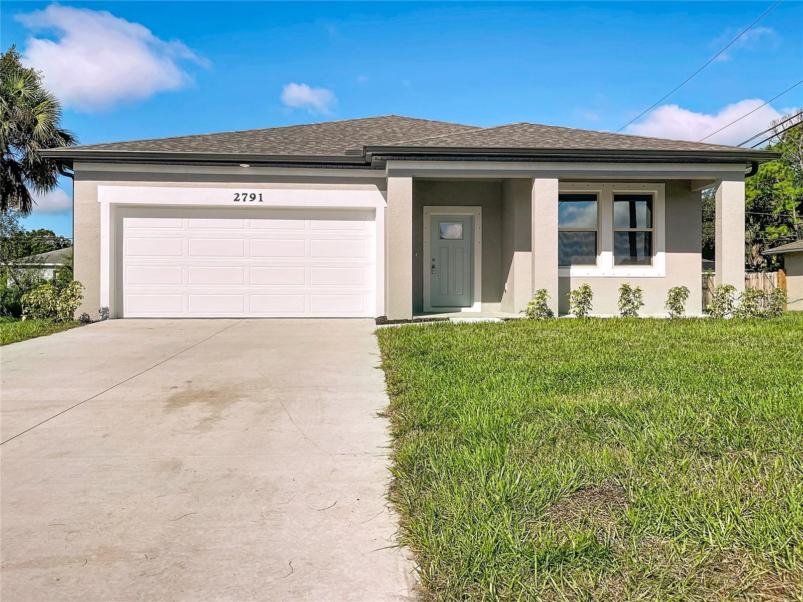 Under Construction. Resibuilt Homes is offering 4.99% fixed rate with seller closing costs contribution on this home! Here it is! A new construction home with city water and septic in North Port and no HOA! This affordable new home is almost ready for you and is just the one you've been looking for—and with city water! This open floor plan has a large main living area with the kitchen-dining room and living room all open together with large windows and sliding glass providing lots of natural lighting. The kitchen space is open with a desk area that features built in granite counters with cabinet drawers and large, separate area for a dining room. The dining room is spacious and has sliding glass door access to the rear covered porch where you will have a huge yard. The living room has several LED lights and large picture windows, making the home light and bright. With almost 1600 sq. ft. of living area, this plan lives larger than you can imagine with 3 bedrooms, 2 full baths and a 2 car garage. The front of the home offers a nice size covered front porch leading you into a large foyer area where you'll have the open living area. The home will allow you to enjoy the Florida lifestyle with the outdoor seating area in the front porch and more seating on the rear covered porch area. The primary bedroom is spacious with nice size windows for natural lighting and has an en suite bathroom with glass enclosed, tiled shower, dual vanity with granite tops and a large walk in closet! The two guest bedrooms share a full bath with the same beautiful cabinetry and granite vanity tops. The home includes luxury vinyl flooring throughout the main living area and wet areas for durability and comfort. You'll love these floor as they are easy to maintain and a trending design element in new homes. The spacious kitchen has stainless steel appliances, Shaker-style cabinets with 42" upper cabinets with crown moulding and pull handles and nice granite countertops. There is huge island for additional seating too. The shaker style cabinets and granite continue into the guest bathroom too. Other features include 5 inch base boards, whole house gutters, a garage door opener, R38 insulation, 16 SEER AC unit, LED lighting and more. This home has irrigation sprinklers too! Take advantage of the seller's incentive when purchasing this home or check out any of our other homes under construction. We have a variety of locations and color schemes for you to choose from, so call for a list.