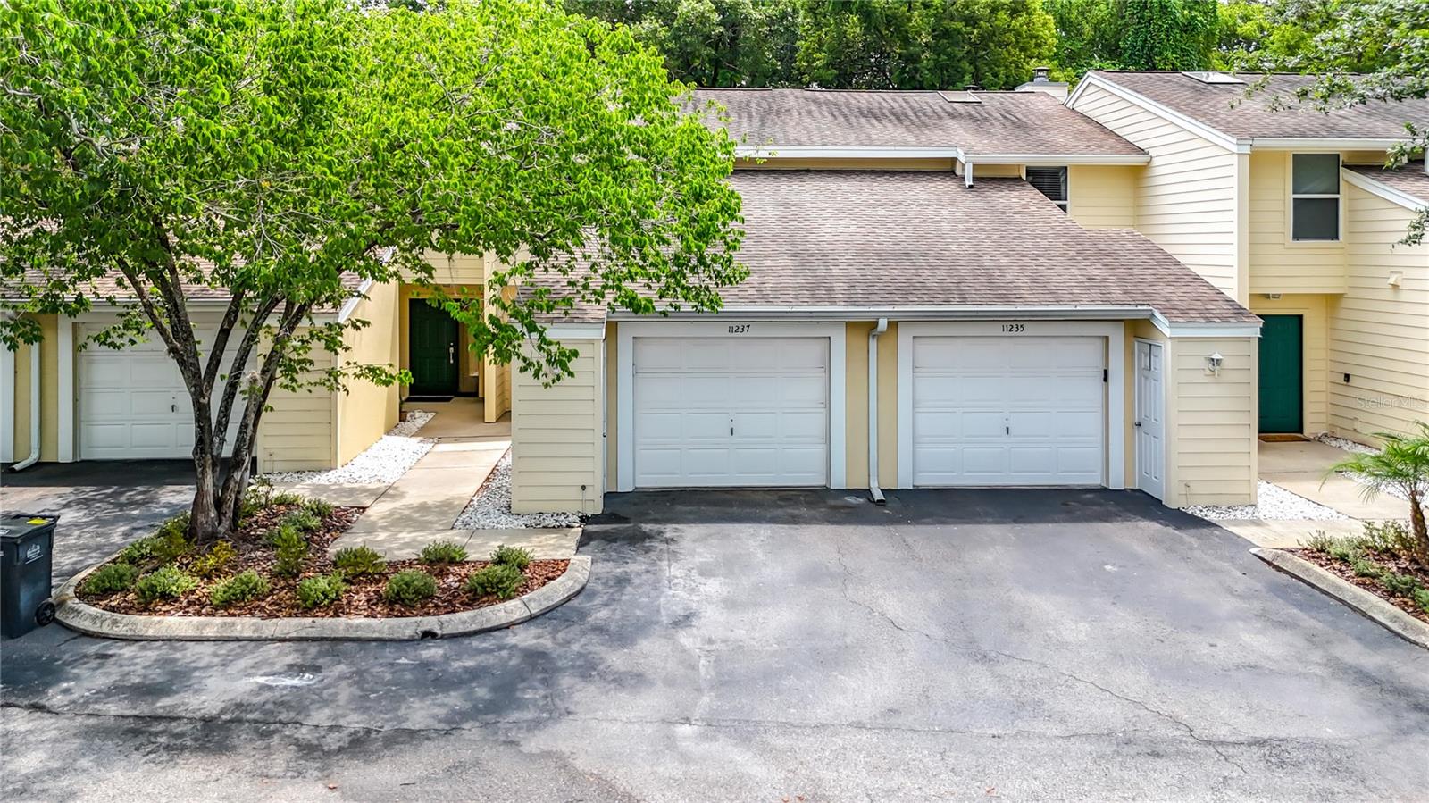 Welcome to this beautifully remodeled Townhome with attached garage in Carrollwood. Located in the peaceful Cedar Hollow neighborhood. Inside you will discover new floors flowing throughout the home. New Quartz countertops in the spacious kitchen, which features a snack bar, breakfast area, real wood raised panel cabinetry. Large sink with stainless appliance package. Upstairs you will find two spacious bedrooms, a Loft area at the top of the stairs which is the perfect area for an office with lots of natural light coming in from the skylight. The bathrooms feature new cabinets, new tile in the shower/tub combo and new lighting fixtures. The owners retreat gives you access to a private balcony with a tranquil view. Updated lighting throughout the home. There is a large washer and dryer included. New AC unit, Interior has been freshly painted with neutral tones. The community is lush and inviting with oak trees and a sparkling pool. The association Dues include water, sewer, exterior maintenance, ROOF, INSURANCE, exterior paint, lawn care, pest control, community amenities. The townhome boasts a prime location which places you minutes from Downtown, Tampa International Airport, major interstates, shopping, dining, and nightlife.