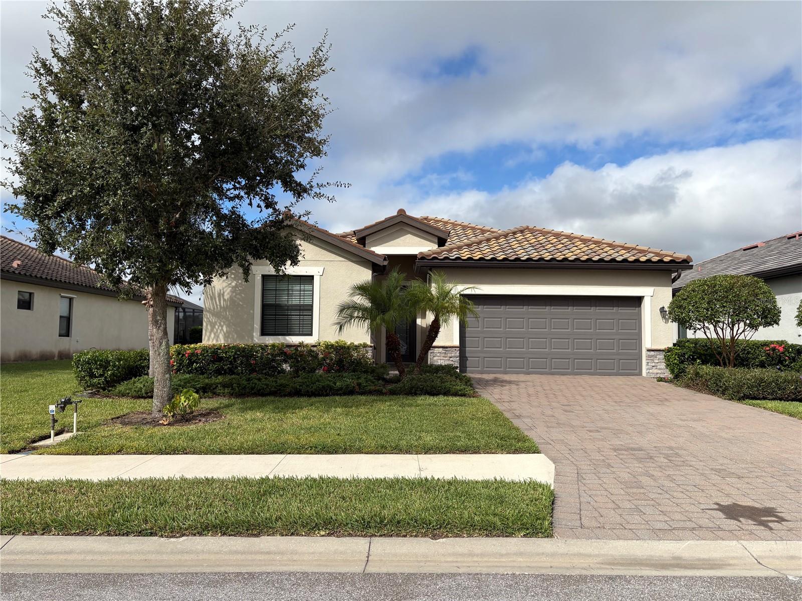 This beautiful 4-bedroom, 3-bathroom home is located in the highly sought-after gated community of Copperlefe. This home is light and bright with an open floor plan that is ideal for families and multigenerational living. The light-filled living area is enhanced by elegant crown molding throughout the main living spaces and the primary suite. The kitchen is both stylish and functional, featuring granite countertops, a large island with seating, pendant lighting, a walk-in pantry, and stainless-steel appliances—perfect for both everyday meals and entertaining. The primary suite offers a private retreat, complete with his-and-her walk-in closets, dual vanities, a luxurious soaking tub, and a fully tiled walk-in shower. Two additional bedrooms share a full bathroom, while a separate guest or in-law suite with its own en-suite bath provides comfort and privacy for visitors or extended family members. Step outside to enjoy a beautifully tiled, screened-in lanai overlooking a tranquil lake—an ideal space for morning coffee or evening refreshments. A two-car garage offers plenty of storage. Lawn and landscaping maintenance are included in the rent. Copperlefe is a well-maintained, gated community featuring a heated community pool and is conveniently located just minutes from I-75, Lakewood Ranch, shopping, dining, and Florida’s stunning Gulf Coast beaches. All tenants are required to participate in the Resident Benefits Package (RBP) for $49.95/month which includes renters insurance, credit building to help boost your credit score with timely rent payments, $1M Identity Protection, HVAC air filter delivery (for applicable properties), move-in concierge service making utility connection and home service setup a breeze during your move-in, our best-in-class resident rewards program, and much more! More details upon application.
