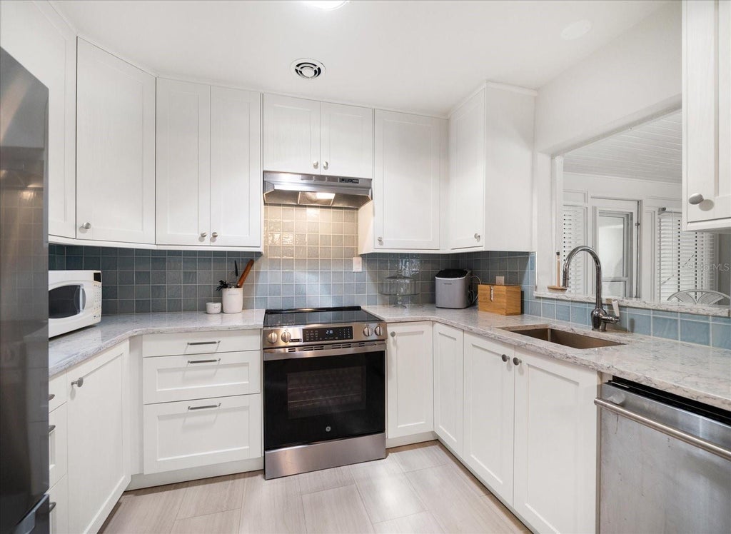 Photo of 745 Bruce Avenue, Clearwater Beach, FL 33767 (MLS # TB8562015)