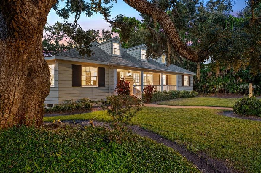 Under contract-accepting backup offers. Welcome to 1585 South Drive, a timeless cottage-style residence in the beloved West of Trail community of Cherokee Park. Thoughtfully updated and rich with character, this home seamlessly blends historic charm with modern comfort. Refinished white oak floors, abundant natural light, stylish finishes, and a gracious, contemporary layout make it truly move-in ready. Elevated more than 10 feet above sea level yet just three houses from the bay, the home enjoys both beauty and peace of mind on a corner lot at the quiet end of the street.

From the inviting brick front porch, step into a foyer with custom board-and-batten detailing. To the right, a generous living room encourages gathering; to the left, a versatile office, den, or sitting room is tucked behind sliding doors for a quieter retreat. Expansive windows frame leafy views and bathe the interiors in light.

At the heart of the home, the oversized kitchen impresses with a large central island, abundant counter space, walk-in pantry, wet bar, and KitchenAid appliances. The adjoining dining room opens to the backyard and screened porch, creating seamless indoor-outdoor living.

The primary suite is privately situated on the main level, offering a spacious walk-in closet, serene ensuite bath, and direct screened porch access. Nearby, a second bedroom with its own hall bath serves perfectly as a guest suite, children’s room, or home office. Upstairs, a private retreat includes a large bedroom with dormer windows, built-in window seats, an ensuite bath, and extensive storage. 

Additional highlights include a recently remodeled marble powder room, a well-equipped laundry room, an irrigation well, and an attached two-car garage. The generously sized lot offers ample room for a pool, guest house, or future expansion. 

Sarasota's West of Trail neighborhoods are coveted for their proximity to Sarasota Memorial Hospital, downtown, and the sugar white sands of Siesta Key. Cherokee Park is perhaps the most prized of these, celebrated for its stately homes, wide tree-lined streets with sidewalks, walkability to Southside Village and Southside Elementary, and cherished traditions — from bustling Halloweens to twinkling luminaries and carriage rides at the holidays. While the surrounding streets boast their share of impressive new construction, this well-proportioned and well-preserved original stands apart for its enduring charm, turnkey livability, and exceptional value. Designer furnishings by Pecky Interiors are optionally available.