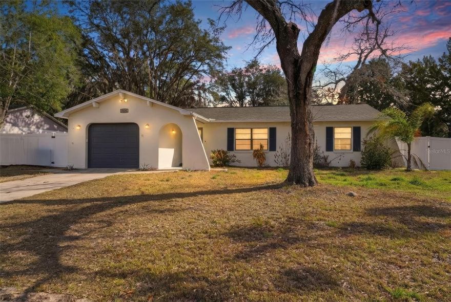 Tucked onto a 0.23-acre lot, this 2-bedroom, 2-bath , 1-car garage home offers a split floor plan and all the necessities. The covered walkway leading to the main entrance features a garden space that serves as a blank canvas, ready to be customized to your vision.  As you enter into the foyer, you’ll find a coat closet, and to your right the living room featuring tile floors, a large window bringing in light, and a vaulted ceiling which adds height and space to the area. The living room flows directly into the dining area, which also features the same tile flooring and white framed double French doors that open to the sunroom, creating a natural connection between indoor and outdoor spaces. Just beside the dining area is the kitchen, which includes white plank tile flooring, a translucent panel ceiling that helps diffuse light across the room, upper and lower white cabinetry, matching white appliances, and a dual sink positioned beneath a window overlooking the yard. An extended L-shaped counter provides additional workspace and serving area. The primary bedroom features tile flooring, multiple windows, a walk-in closet with customized organization system, and direct access to the ensuite bathroom. The ensuite has a very clean and updated look, with all white tile, vanity, counters, and cabinetry, and a glass enclosed step-in shower with built in shelves. Along the other side of the home, the second bedroom features matching tile flooring, windows, built-in closet, and it’s own ensuite bathroom that has a tub and shower  combo, granite countertop vanity, a large framed mirror and cabinet storage below. At the rear of the home, the sunroom continues with the same tile flooring and features walls of windows and and direct access to the backyard patio. The rear yard offers open space for outdoor use, has some beautiful mature trees providing shade, and includes a storage shed and vinyl fencing which offers privacy.  Located in Spring Hill, the home provides convenient access to nearby attractions including Weeki Wachee Springs State Park where visitors can kayak, paddleboard, and explore clear spring waters, Pine Island Park offering Gulf views, fishing areas, and beach access, and the Suncoast Parkway which provides a direct route toward Tampa for shopping, dining, and travel. Please note that the sellers will not be able to close until the end of May.