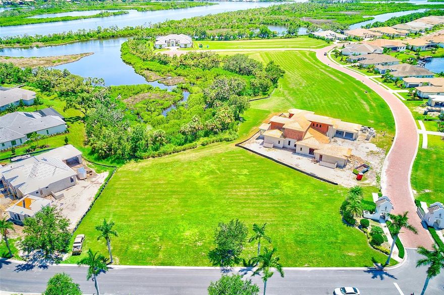 Incredible Opportunity to Build Your Custom Dream Home with Deeded Boat Dock!
Discover one of the final and most desirable homesites available in the River Wilderness phase of The Islands on the Manatee River — an award-winning, exclusive, gated waterfront community renowned for luxury living and natural beauty. Located on picturesque Rive Isle, Lot 14 offers a generous .81-acre parcel, perfectly positioned to capture sweeping views of both tranquil water and protected preserve.
This custom-home neighborhood allows you to design your ideal residence starting at 2,800 square feet (or go even larger!) with the freedom to choose from a curated list of top-tier builders or bring your own. Included in the purchase are a 13,000-pound boat lift and  Deeded Boat Slip #11, capable of supporting a boat up to 30 feet in length. The community also hosts its own boat slip, perfect for launching kayaks and enjoying a day out on the water.
Set within 225 acres of pristine Florida landscape, this private enclave is surrounded by championship golf courses and lies just south of the prestigious River Wilderness Golf & Country Club. As a resident, you'll benefit from no CDD fees and enjoy access to the exclusive River Lodge, a private retreat offering social spaces, a fitness center, business lounge, and more.  Optional golf and club memberships are available at the neighboring River Wilderness clubhouse, where residents could also enjoy tennis, pickleball, a resort-style pool, spa, and a newly renovated outdoor lounge with stunning golf course views.
Boaters and outdoor enthusiasts will love the convenience of the nearby Fort Hamer Park and boat ramp — home to a world-class rowing facility and a local favorite for watching wildlife, rowers, boaters, or simply soaking in the riverfront atmosphere.  This location also offers unmatched access to everything you love about Florida living, including its proximity to our world-famous beaches (Anna Maria Island, Siesta Key, and St Pete Beach are all within 30-45 minutes of this community!), unlimited shopping & dining experiences (UTC Mall, Ellenton Premium Outlets, downtown Bradenton/St Petersburg/Sarasota), multiple international and local airports (easy accessibility for you and your visitors!), numerous sports venues & teams, parks, and entertainment galore.  Whether you're looking to relax in a beautiful, tranquil Florida environment or hit the town for a fun night out, this location is truly the best of both worlds and has got you covered!
One of the final lots remaining in this exclusive community, this property represents a rare chance to design an uncompromising custom home in a setting that combines natural tranquility with refined coastal living.  Build your personal oasis in one of Florida’s most sought-after communities. Now is the time to make your move and start living the lifestyle you’ve always dreamed of at The Islands on the Manatee River.
