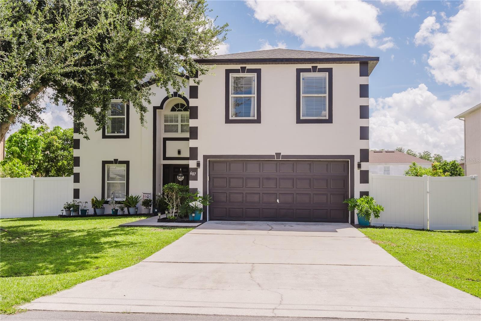 Gorgeous 2 story home, impeccable condition and ready to move in! Oversized master suite, ample rooms all over, spacious 2 car garage and beautiful fenced backyard. Minutes from 192, multiple shopping plazas, hospital and everything you may need. Also, very close to park with courts, playground and other amenities. A retreat close to all attractions and activities in Central Florida. Perfect space for a large family with lots of room and harmonious feel.