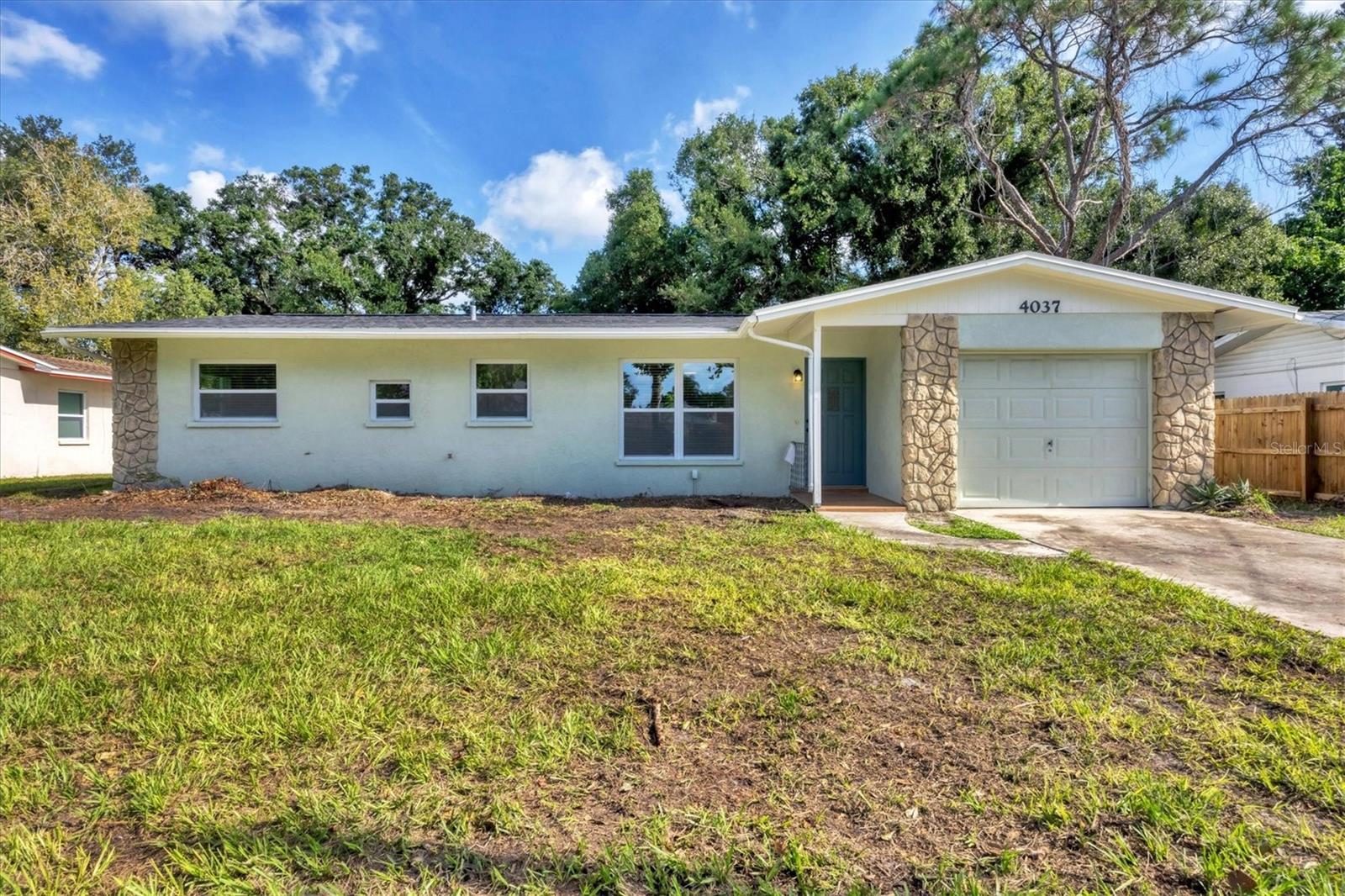 This freshly remodeled 3 bedroom, 2 -bathroom residence offers modern luxury and quality materials. NEW ROOF, NEW AC. Step inside to find stunning honey oak vinyl floors that flow throughout the open living spaces. The kitchen has crisp white shaker cabinets, gleaming new stainless steel appliances, and a spacious brown fantasy granite bar perfect for casual dining. Both the interior and exterior have been freshly painted. This exceptional home boasts two freshly updated bathrooms, the primary bathroom has a curb less shower. Year-round security with impact hurricane-resistant windows and a new air conditioner. Practical updates abound, including newer waterlines, a newer water heater and PVC drains. For added convenience, there's an interior laundry room. This home is being connected to county SEWER with a new PVC drain line. Don't miss the opportunity to own this meticulously updated Sarasota gem! Located in the middle of town, 15 minutes to Siesta key and check out the wonderful shopping centers within minutes of this home.