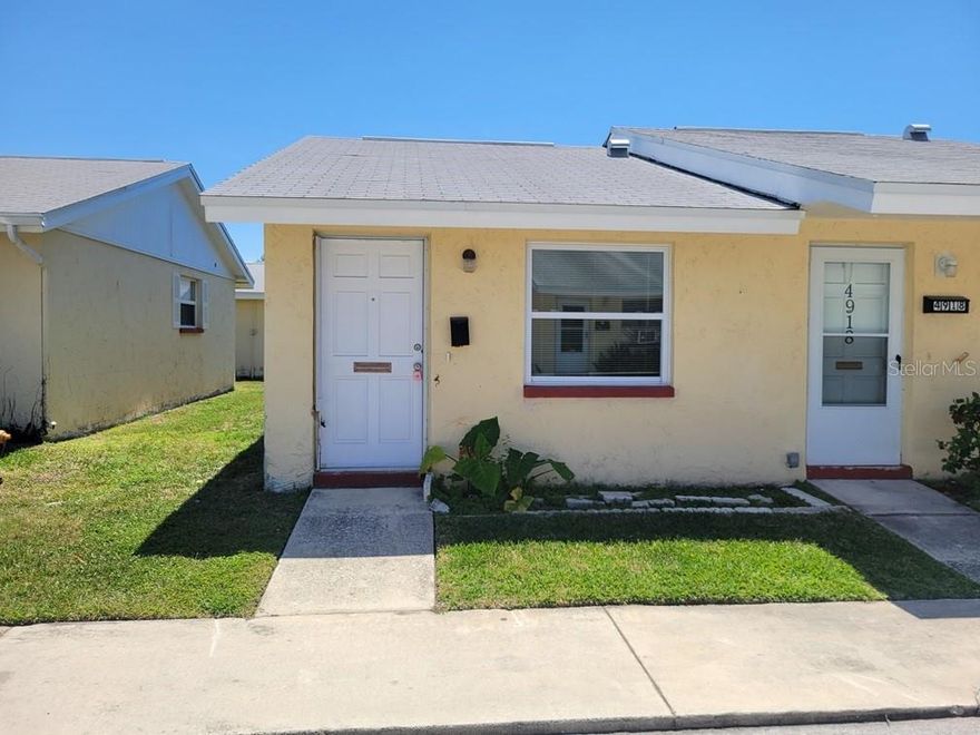 Charming 1 Bed/1 Bath villa located in the desirable 55+ New Port Colony community! This bright end unit has neutral paint and features a completely renovated kitchen with brand-new cabinets, countertops, and appliances. The bedroom offers new carpet, while two new split AC units—one in the living area and one in the bedroom—provide efficient comfort year-round. Residents enjoy access to a community pool, shuffleboard courts, car wash station, and on-site laundry facilities. The monthly HOA fee covers water, sewer, trash, maintenance of the common areas, and more for easy, low-maintenance living. Optional membership to the private Gulf Harbors Beach Club offers access to a beautiful sandy beach. Conveniently located near shopping, dining, and public transportation.