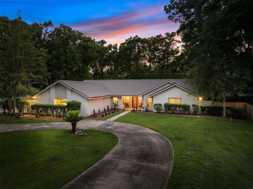Tucked inside one of Ocala’s hidden gem neighborhoods, this 4 bedroom, 2.5 bath pool home sits on 1.19 acres with a rare blend of space, privacy, character, and convenience. Offering 3,292 square feet, the home features a warm and inviting layout with LVP flooring throughout the main living areas, crown molding, and a spacious family room anchored by a beautiful wood beam and fireplace. The kitchen is bright and well appointed with granite countertops, stainless steel appliances, abundant cabinetry, and a large island that makes everyday living and entertaining easy. The primary suite is a true highlight with a beautifully remodeled bath featuring dual vanities, a walk in shower, soaking tub, and a generous walk in closet. A dedicated office adds flexibility for working from home, studying, or creating a quiet retreat. Out back, the property opens up to a private outdoor setting with a large pool, spacious patio area, sprawling fenced yard, and wooded privacy along the rear of the lot. Two storage sheds provide additional functionality, while solar panels, a 2019 metal roof, and 2024 windows add meaningful value. Located just minutes from Silver Springs and approximately 5 miles from downtown Ocala, this property offers an exceptional setting with space to enjoy both indoor comfort and outdoor living.