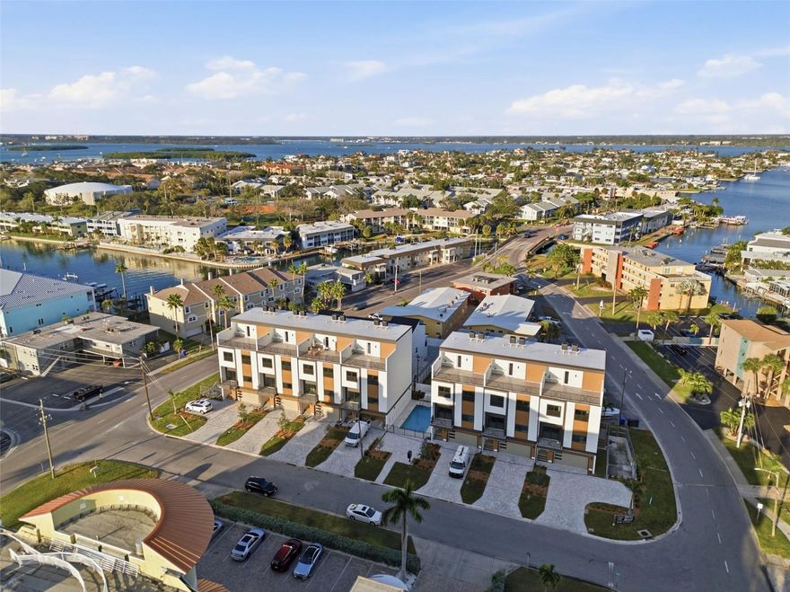 One or more photo(s) has been virtually staged. NOW COMPLETE WITH CERTIFICATE OF OCCUPANCY IMMINENT! FLOOD-ZONE ELEVATED construction with LUXURY FINISHES. ZONED FOR NIGHTLY + WEEKLY RENTALS VRBO & Airbnb LEGAL. PET-FRIENDLY Two pets allowed, no weight limits. ROOFTOP DECKS with GULF VIEWS, wet bars & hot tub reinforcement Capri Townhomes - The Ultimate Beachside Investment + Lifestyle Opportunity Introducing Capri Townhomes, a boutique enclave of just seven stunning 5-bedroom, 4-bath luxury townhome-style condos, each designed to elevate your coastal living experience. With nearly 2,800 square feet of well-thought-out living space, private rooftop decks, Private Elevator in unit, oversized 2+ car garages, and a community pool, this exclusive development truly offers it all - and it's just steps away from the pristine sands of Treasure Island and iconic John's Pass Village. Whether you're seeking a primary residence, a savvy second home, or a short-term rental powerhouse, Capri delivers the rare combination of full flexibility, luxury, and legal rental freedom on the Gulf Beaches. Few properties in this market offer true short-term rental eligibility without restriction, and even fewer with this level of design and quality. Third party projections show annual revenue around $200K. Please check with your accountant about Cost Segregation studies for depreciation. 3rd party cost segregation tax benefit estimate of $245,000 that the buyer may be able to reduce their taxable income by… buyer to confirm with their tax advisor. Perfect for 1031 exchanges. Each unit has been crafted with modern coastal living in mind - from remote-work-friendly floor plans to rooftop entertaining spaces that bring the Florida sunset to your doorstep.