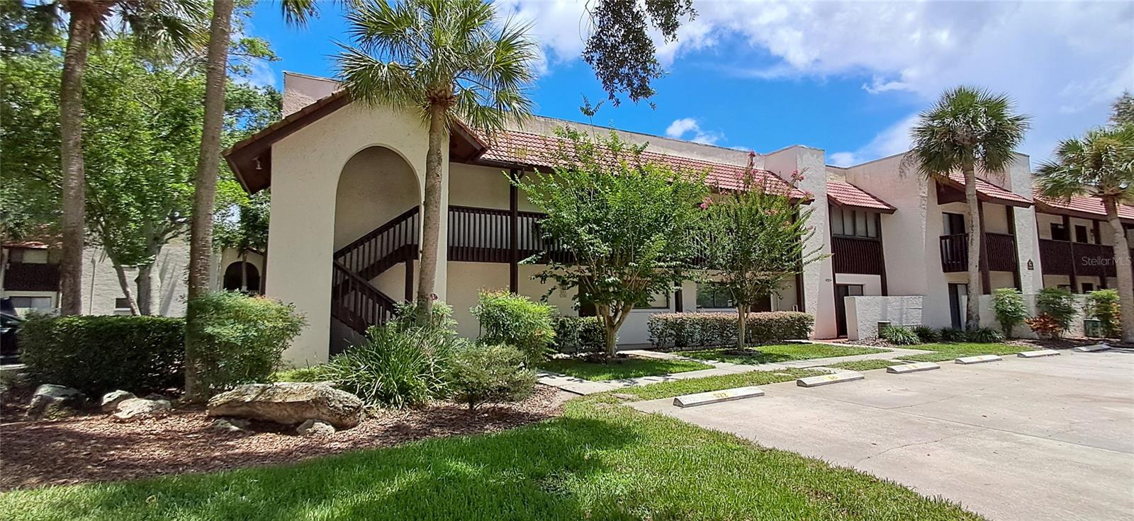 Step into this spacious, beautifully renovated, end-unit condo in Lake Wales Country Club and Golf! The open floor plan features gleaming, neutral tile flooring, a large living-dining area, and a well-equipped kitchen with ample cabinetry and stunning solid surface countertops. From the expansive enclosed patio, enjoy breathtaking water views, abundant wildlife, and the community pool. The patio offers storage, electricity, and plenty of living space with accordion sliding glass doors for seamless indoor-outdoor living. The main bedroom boasts an en-suite with vanity, walk-in closet, and access to the enclosed patio. The secondary bedroom is roomy and cozy, complete with its own patio for a refreshing breeze. Conveniently located near shopping and restaurants, the theme parks and beaches are not far away, this condo is perfect for embracing the Central Florida lifestyle. Call now for a private showing!