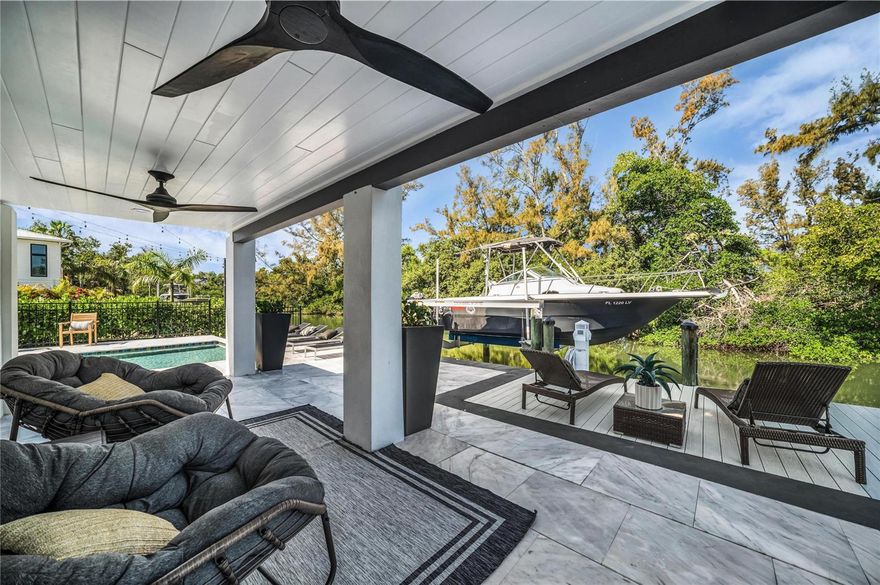 Fully Renovated in Coveted Longbeach Village, This Waterfront Retreat Captures the Rare Charm of Old Longboat Key with the Polished Ease of Like-New Coastal Living...Positioned on a Saltwater Canal with a New Seawall, New Dock with Trex Decking, 8,000-Lb Boat Lift, Dual PWC Accommodations, Dock Lighting, Electrical, and Water, This Home is Designed for the Boating Lifestyle without Sacrificing Style, Comfort, or Convenience...Inside, the Residence Showcases Light-Filled Interiors, a Dramatic Floating Staircase, Ceramic Tile Flooring, Designer Finishes, and an Effortless Indoor-Outdoor Flow Made for Relaxed Island Living...the First Floor Features a Newly Added True Fourth Bedroom, a Sleek Entertaining Bar with Built-In Draft Beer System, and Open Living Spaces that Connect Beautifully to the Private Outdoor Setting...Upstairs, the Gourmet Kitchen Offers Built-In Appliances, Quartz Countertops, Soft-Close Drawers, Undercabinet Lighting, Wall Oven, Cooktop with Externally Vent Hood, a Large Island with Basin Sink, and Generous Storage...Outdoors, the Saltwater Pool and Spa, Premium Landscaping, Extensive Landscape Lighting, ClearView No-See-Um Screening, Covered Terrace, and Canal Views Create a Private Resort-Style Escape for Everyday Living and Effortless Entertaining...Ownership Has Been Thoughtfully Strengthened with New Impact Windows and Doors, a Newer Roof, Updated Dockside Infrastructure, Enhanced Energy Efficiency, and Refined Interior and Exterior Improvements Throughout...Set in One of Longboat Key’s Most Beloved Coastal Enclaves, the Property is Moments from Mar Vista, Shore, Whitney’s, Iconic Nearby Sandbars, Sarasota Bay, White Sand Gulf Beaches, and Open Water Just Beyond the Canal...Offered Fully Renovated and Thoughtfully Finished, This is a Rare Opportunity to Own a Substantially Enhanced Waterfront Home in Longbeach Village...Book Your Private Tour Today and Live a Fuller Life on Longboat Key.