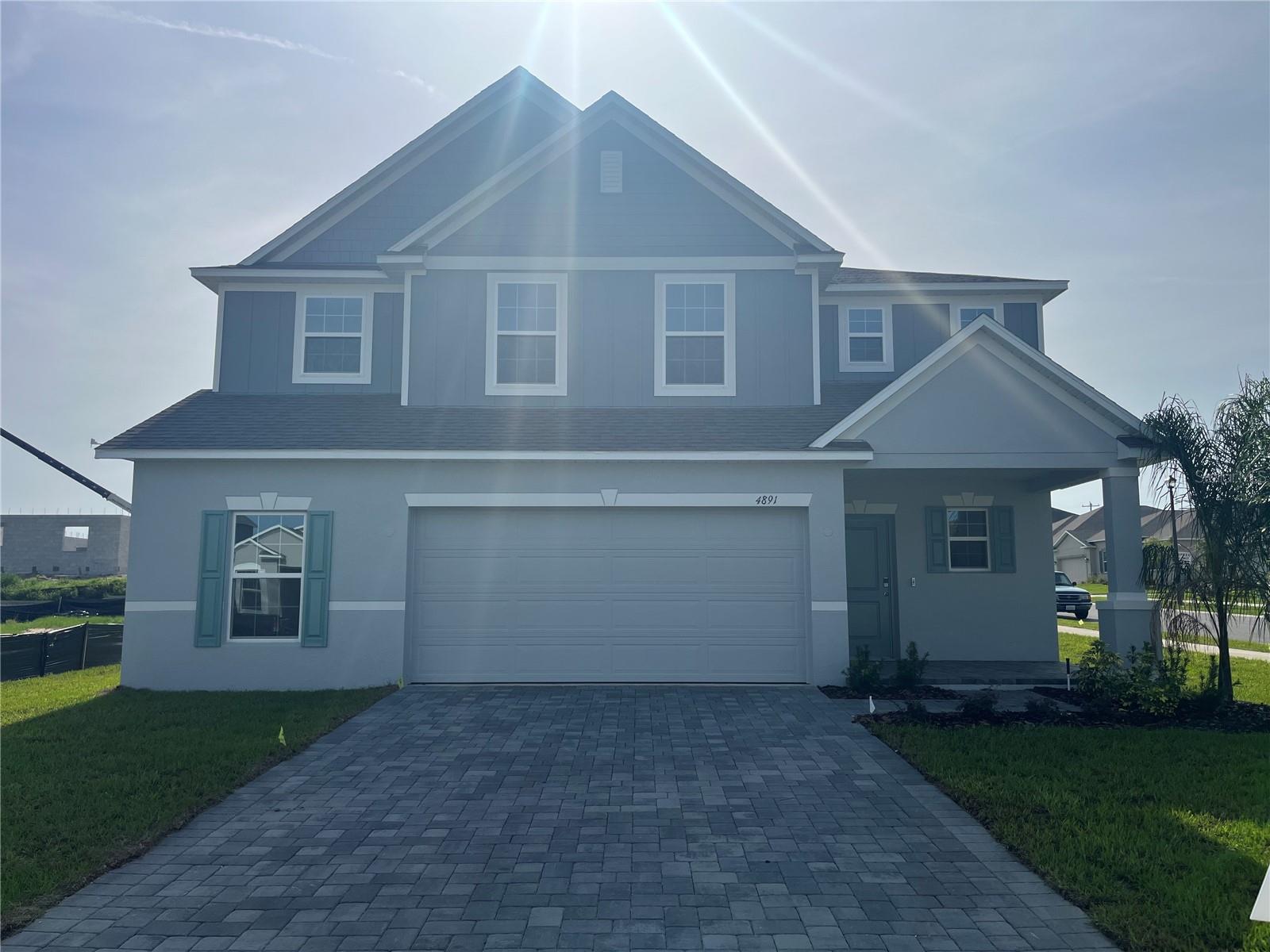 Move in Ready! Welcome to Villa Pass, a vibrant community where comfort meets style and every detail is designed for the perfect Florida lifestyle. This beautifully crafted two-story home offers the ideal blend of modern features, flexible spaces, and lasting quality, located on a desirable corner lot.
Step onto the paver entryway and through the inviting front door into a home that immediately impresses. The elegant foyer opens to a spacious great room with sliding glass doors leading to the patio—perfect for indoor-outdoor living. A generous dining/game room and a flexible den or office space provides room to live, work, and entertain. A convenient half bath adds to the thoughtful first-floor layout.
The heart of the home is the open-concept kitchen, featuring quartz countertops, 42" cabinets, and upgraded stainless steel appliances—including the refrigerator—all designed to inspire your inner chef. Elegant ceramic tile flooring spans the entire first floor, adding both style and durability.
Upstairs, discover four spacious bedrooms, a versatile loft, and a large second-floor laundry room complete with washer and dryer for everyday convenience. The luxurious primary suite features a walk-in closet, sitting area, and a spa-like en suite bath with dual sinks, walk-in shower, and a private water closet.
Smart storage solutions include multiple linen closets, under-stair storage, and a dedicated workshop area in the two-car garage. The home is topped with architectural shingles, combining curb appeal with long-lasting protection.
Enjoy peace of mind and modern ease with built-in smart home features, including a Z-Wave thermostat, video doorbell, keyless entry keypad, and front door light. Additional highlights include a garage door opener, paver driveway and entry, and a full irrigation system to keep your landscaping lush year-round.
This home will be ready by summer, giving you the perfect opportunity to make it your own. Plus, it comes with a full builder warranty, offering extra confidence in your investment.
Don’t miss your chance to own this exceptional home on a corner lot in Villa Pass—schedule your private tour today!