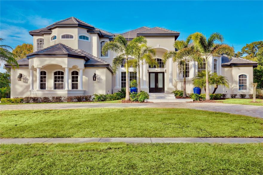 *The furnishings are SOLD SEPARATELY and are NOT included in the listing price ASK REALTOR FOR MORE INFO. Step into contemporary elegance inside and out.  This Remodeled 5 Bedroom 3.2 bath oversized two car garage pool home is located in the exclusive private gated community of Balmoral.  The entire home has been completely remodeled with a contemporary touch.  This over sized lot features an elegant circular driveway and one of a kind backyard resort style escape.  There is a full size Beach Tennis/Volleyball sand court beside a relaxed private pool oasis.  As you walk through the double doors you are greeted with an open concept consisting of 2 large open living/entertaining areas.  The glass railings run throughout the balcony and main stairs.  The Primary is located on the first floor while the three guest bedrooms are opposite on the second floor.  The stunning oversized Spanish porcelain tile runs throughout both first and second floors.  The brand new contemporary kitchen is perfect for entertaining large families and friends.   The primary bedroom features an huge open concept bathroom with plenty of storage space and elegance.  The home also features the latest high speed technology package throughout the home and property.