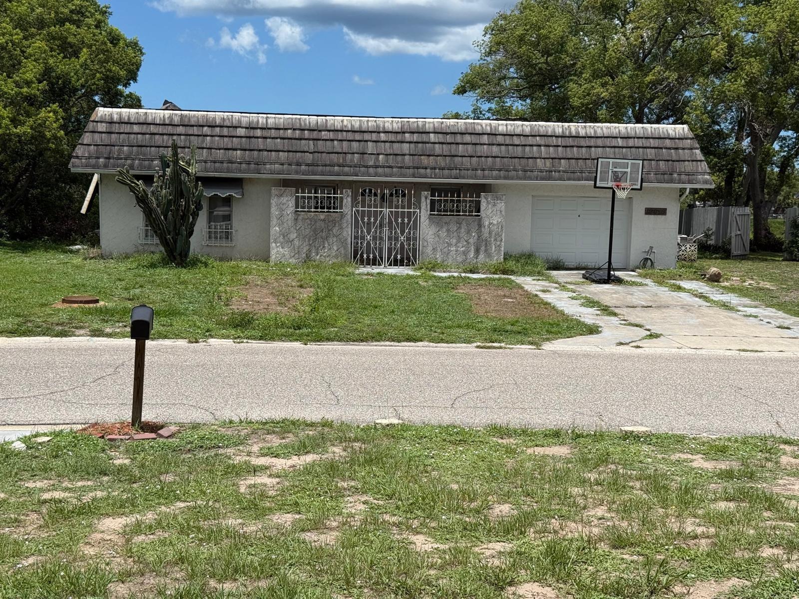 Unlock the Potential for this prime rehab opportunity! Roof was previously damaged and flat roof was recently re-roofed and completed. This three bedroom two bath home awaits transformation and perfect for homeowners wanting to design a custom living space. Includes in-ground pool and lake views! At this price it will not last!