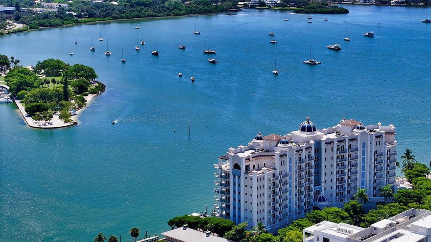 Located on Golden Gate Point, Sarasota’s premier bayfront address, this turnkey furnished 3BR + den / 4th bedroom, 4.5BA corner unit embodies luxury living just moments from downtown, St. Armands Circle and pristine beaches. Step off your private elevator into a stunning interior adorned in elegant neutral tones, where dramatic southeast-facing bay and city views captivate through walls of glass, offering breathtaking vistas without the direct west sun. The spacious living room highlights tray ceilings, recessed lighting, custom built-ins and sliders that open to an expansive balcony with a summer kitchen, perfect for entertaining while enjoying the city skyline and sparkling waters.  The gourmet kitchen, featuring custom lighted stone countertops, stainless steel appliances, a large island, breakfast bar, 6-burner range and striking tile backsplash, seamlessly opens to the great room, creating an ideal space for gatherings. The main bedroom suite offers access to the balcony plus his and hers baths with a walk-in shower and a private tub, along with separate walk-in closets. The guest suites, each with en-suite baths and private balconies, provide ample privacy for visitors or family living. With ceiling heights ranging from 9 to 11 feet, this residence is the epitome of elegance, where every detail has been thoughtfully designed for refined living. With 455’ of water frontage, La Bellasara is a gated, pet-friendly community home to a range of exciting amenities, including a private 2-car garage with extra storage space for each resident, full concierge service, heated pool and spa, fully equipped fitness room, movie room with a separate card room, courtesy day dock and a complete social room with a full kitchen.