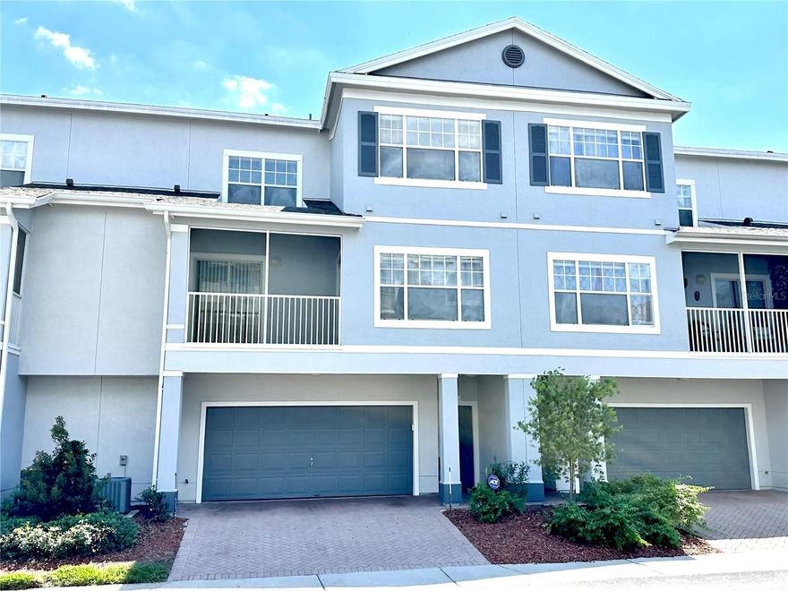 Welcome to The Estates at Park Central, a highly desirable 24/7 guard-gated community located just one mile from the Mall at Millenia. This immaculate townhome offers the perfect blend of space, comfort, and convenience, featuring 3 spacious bedrooms, 2 bathrooms, an oversized 2-car garage - deep enough to easily park two SUVs while still having plenty of room for a small trailer - and a 2-car driveway.

All bedrooms include large walk-in closets, providing ample storage throughout. The private primary suite is located on the second floor and features direct access to a screened porch — the perfect spot to enjoy your morning coffee or unwind in the evening. The additional oversized bedrooms on the third floor (approximately 16x11 and 12x14) share convenient access to a full bathroom.

The open-concept layout includes a well-equipped kitchen with breakfast bar overlooking the expansive living and dining areas, ideal for entertaining or everyday living. An inside utility room with washer and dryer adds extra convenience.

Residents of Park Central enjoy an exceptional resort-style lifestyle with amenities including a two-story fitness center, indoor basketball court, tennis courts, sand volleyball courts, swimming pools, scenic walking paths, an on-site restaurant and bar, convenience store, and more.

Enjoy worry-free living with an HOA that covers exterior maintenance—including a new roof (2021) and fresh exterior paint (2025)—plus high speed 1GB Spectrum internet. It is a well-run community backed by strong financial reserves.

Ideally located near shopping, dining, entertainment, and major highways, this beautiful townhome offers the perfect combination of privacy, lifestyle, and prime Orlando location.