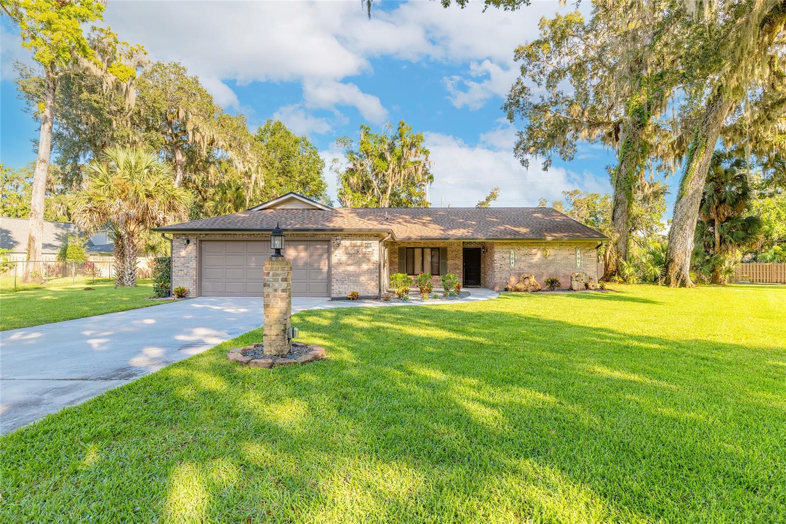 Welcome to beautiful Halifax Plantation Golf Community! Located on a large 0.62 acre cul de sac in a park like setting, this all brick residence offers the perfect blend of comfort, style and indoor-outdoor living. Step inside to an open floor plan featuring vaulted ceilings and an abundance of natural light. A sliding glass door with pockets seamlessly connects the main living area to a large, screened-in pool and patio - ideal for entertaining or relaxing in your private oasis. The heart of the home is beautifully appointed kitchen, complete with tall cabinetry, elegant glass-front accents, convenient pull-out shelving and a beverage bar. A charming Good Morning room overlooks the sparkling blue pool, offering the perfect spot for coffee and conversation. The private master suite features two generous closets and a raised vanity and glass enclosed shower in the ensuite bath. Tucked away from the other bedrooms, it's your personal retreat. The two additional bedrooms are ideal for family or a home office and share a tiled bath with combination tub and shower. The third bedroom offers a sliding glass door opening directly to the pool area. Enjoy the ultimate Florida lifestyle with this large screened-in pool. The screen enclosure provides shade and comfort while letting in the sunshine and gentle breezes, creating a perfect space for swimming and entertaining year-round. The convenient Cabana bath offers storage for pool equipment. The oversized garage provides plenty of space for all your toys and gear. Roof 2020, AC 2018, Massey termite bond, irrigation on well. Halifax Plantation offers easy access to services, restaurants, shopping and I-95. The closest beach is only 2.5 miles away!