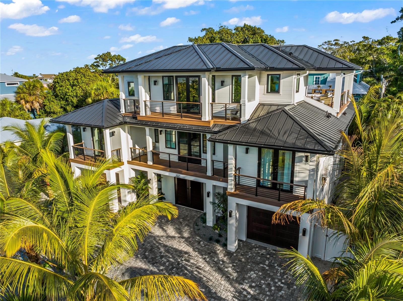 This custom built six bedroom six and a half bathroom turnkey luxury investment property on Anna Maria Island is the ultimate beach home for passive income and personal enjoyment, located on one of the most private and prestigious streets with beach access just two houses away and stunning Gulf of Mexico views. Designed as both a high performing vacation rental and private coastal retreat, this Anna Maria Island luxury home features a resort style pool with in ground spa, rooftop deck with panoramic sunset views, open concept living spaces, gourmet kitchen with top of the line appliances, custom cabinetry, oversized island and formal dining area, along with a seamless indoor outdoor flow to multiple balconies and covered patios. The primary suite offers a private balcony, walk in shower and soaking tub, while four additional king suites each include ensuite bathrooms and a custom bunk room adds a family friendly touch. Exclusive amenities include a private elevator, luxury beach bikes, Club Car golf cart, upgraded linens, beach chairs, and a welcome package for guests. The backyard oasis offers a poolside lounge, BBQ grill, ping pong table and stylish entertaining areas, making it one of the best Anna Maria Island homes for sale for both relaxation and rental income. Perfectly located near Pine Avenue’s boutique shopping, island dining, the Rod and Reel Pier, historic AMI city pier and the free island trolley, this one of a kind Anna Maria Island turnkey vacation rental property combines luxury, location, and strong income producing potential for buyers seeking the best real estate investment on Florida’s Gulf Coast.