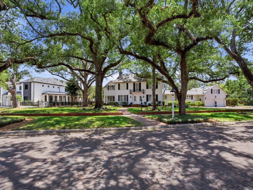 Set along the prestigious Palma Ceia Golf Course in South Tampa, this exceptional Colonial estate rests on an expansive, two lot, park-like parcel exceeding 30,000 square feet with 166’ of golf course frontage. Framed by mature trees and lush, curated landscaping, the residence enjoys a picturesque setting along a charming brick-lined street, adjacent to a serene side park.
Inside, the home reveals a masterful blend of timeless sophistication and inviting comfort. Offering four elegant bedrooms, two smaller private offices, a sunlit garden room, and refined formal living and dining spaces, every corner is designed for both grand entertaining and intimate living. A distinguished sitting room, or library, and powder room add to the home’s classic appeal, while the well-appointed kitchen flows seamlessly into a warm family gathering area overlooking the sweeping golf course vistas and expansive grounds beyond. The third office is a major room off the living room that overlooks the golf course and private terrace. 
A dramatic sweeping staircase, accented by dual landings, leads to three beautifully proportioned bedrooms, a shared bath, and a tranquil sitting area within the primary suite. The primary retreat is further enhanced by an extraordinary, room-sized dressing closets for his and hers. A secondary staircase offers a private ascent to the fourth bedroom suite, distinguished by its unique architectural ceilings and charming character and cathedral ceiling sitting area overlooking the golf course.
Throughout the home, each room is meticulously curated with period antiques and collectible details, evoking the ambiance of a refined gallery while maintaining a light-filled, airy atmosphere. Outdoors, an expansive patio and elegant pavilion provide a stunning setting for entertaining, all against the breathtaking backdrop of the golf course.
A rare offering, this residence embodies classic Old World elegance with a relaxed yet sophisticated sensibility—truly one of a kind. Located in the heart of South Tampa, Tampa International Airport, Midtown, premier shopping, major malls, and top-rated schools are all within proximity. Gulf beaches and local theme parks, Busch Gardens and Zoo Tampa are approximately 20 minutes away and only an hour and a half to Disney.