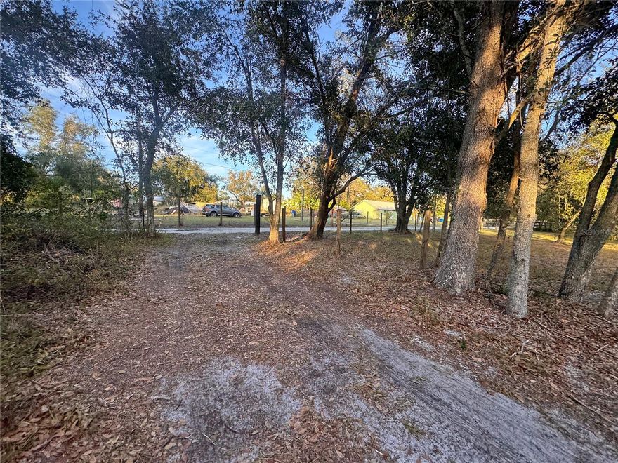 Discover 6.19 acres of beautiful, native Florida land—one of the few parcels that offers a great deal of seclusion. Build your own private retreat on this tranquil property, which features stunning oak trees. This spacious agricultural-residential land is well-shaded and offers ample privacy. With its generous size and versatility, it offers a wide range of agricultural opportunities, accommodating everything from gardening to livestock. The property serves as a hassle-free starting point for construction or farming activities. Zoned A-5, it permits traditional and manufactured homes. Don’t miss your chance to create the life you’ve always envisioned in this unique space!