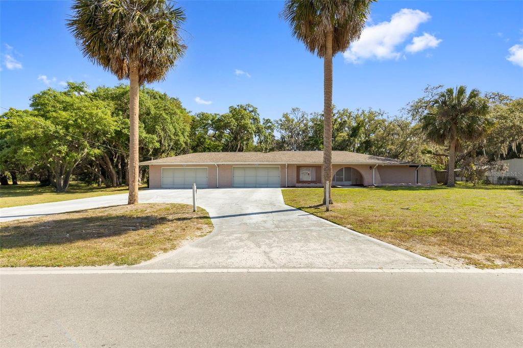 Photo of 8976 Lake Drive, New Port Richey, FL 34654 (MLS # W7885075)