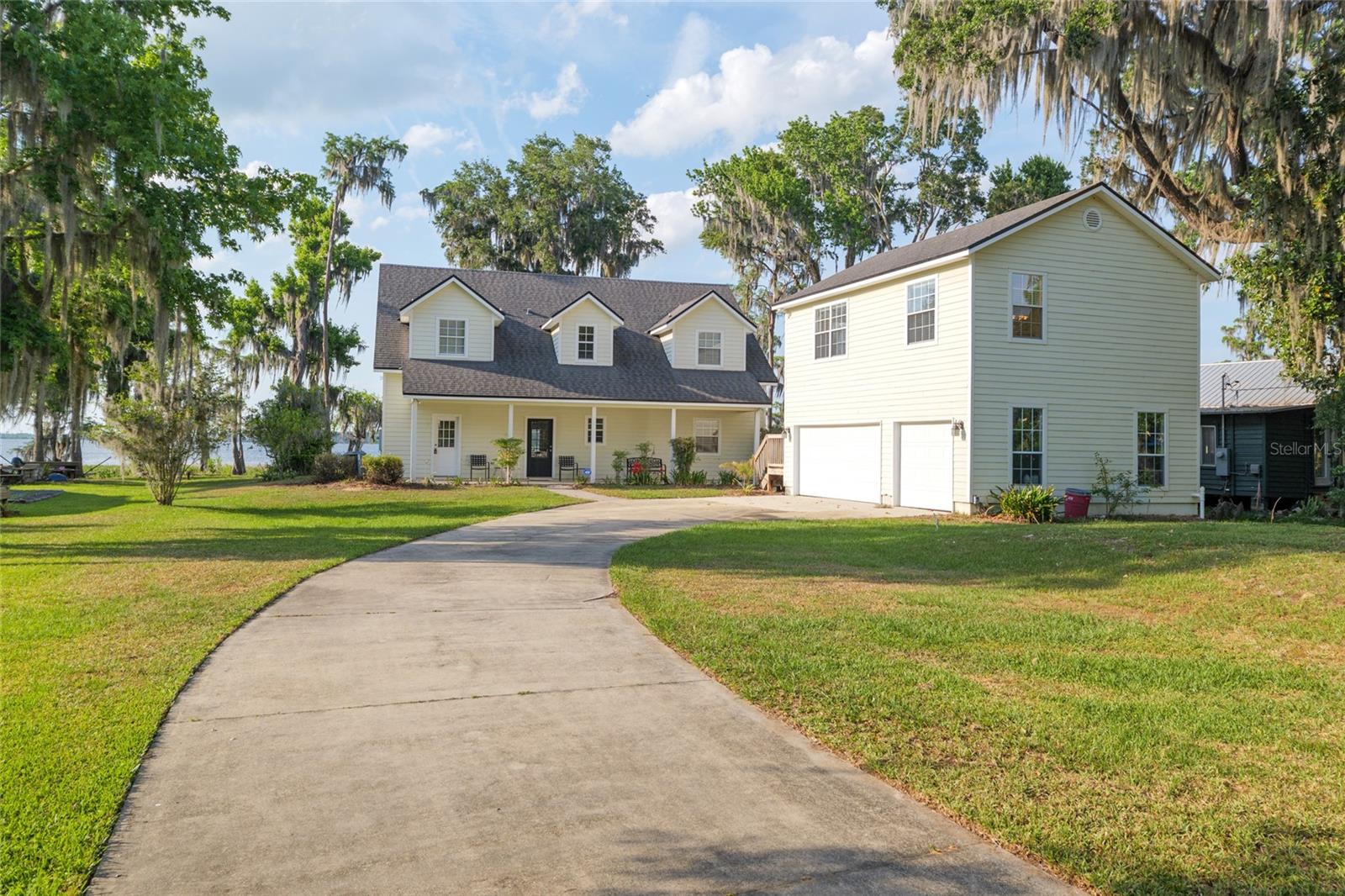 DIRECT LAKEFRONT- Lake Santa Fe, is rated one of the BEST natural spring fed lakes in Florida. This listing is priced below recent appraised value on 04/2025. Welcome to your dream family lake house! Nestled on a tranquil lot with panoramic water views, this stunning lakefront home is designed for both relaxation and entertaining. With its spacious living areas, it’s the perfect place to create unforgettable memories. The main home features 3 generous bedrooms and 3.5 bathrooms, an open-concept kitchen and living room flowing onto a screened-in porch with stunning lake
views. Upstairs you will find 2 large bedrooms, each with ensuite bathrooms along with a cozy second living area- ideal for guests. This property also features an oversized 3-car garage with ample storage for boats and lake gear. Above the garage you will find a fully finished 1-bedroom, 1-bathroom guest apartment with a full kitchen and living room- perfect for extended family, visitors, or Airbnb potential. This beautiful home sits on 0.69 areas, designed for outdoor enjoyment and easy lake access, less than a mile from the boat ramp with plenty of space to park a boat or RV. Enjoy your days on the lake or enjoying the two screened-in porches to soak in the lake breeze. This home isn’t just a property—it’s a lifestyle. Enjoy sun-soaked days by the water, evenings under the stars, and every special moment in between. Whether you're looking for a full-time residence or a weekend escape,
this lakefront gem offers everything you need and more. This Amazing location is only 25 minutes to Gainesville, 5 minutes to downtown Melrose
and 15 minutes to Keystone Heights. Big Lake Santa Fe is a 5800 acre, aquifer fed stable lake with amazing fishing, recreation and water sports. Come for the views and stay for the peace and relaxation in this turnkey lakefront home! While all information is believed to be accurate, measurements should be verified by potential buyers.