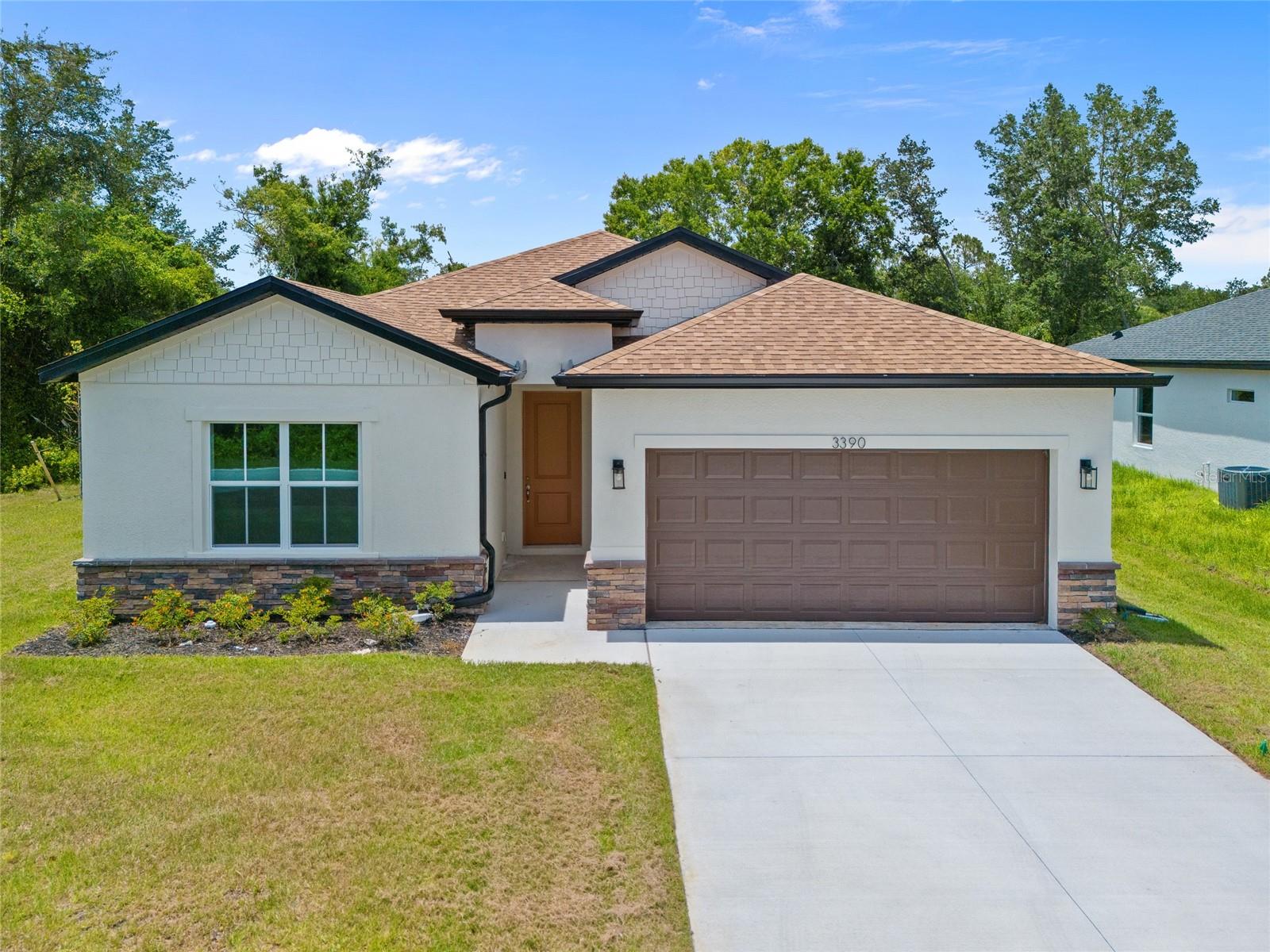 NEW CONSTRUCTION! BUILDER INCENTIVE AVAILABLE! FURNISHED MODEL LOCATED AT 4131 BULA LN - SCHEDULE THROUGH SHOWINGTIME. GREAT INVESTMENT OPPORTUNITY OR PERMANENT RESIDENCE! SPACIOUS 4 BEDROOM, 3 BATH, 2-CAR GARAGE HOME ON 1/4 ACRE IN NORTH PORT! Spacious open floor plan features 1,990 sf of living space, 9’ 4” ceilings, 8’ doors and luxury vinyl plank flooring throughout. Well-appointed kitchen offers quartz countertops, tile backsplash, Samsung stainless appliances, closet pantry and center island with breakfast bar overlooking dining area with slider to lanai. Primary suite features tray ceiling, his and hers walk-in closets and private bath with dual sinks and walk-in shower. Split floor plan provides privacy for all with 2 nicely sized guest bedrooms with separate full bath plus the 4th bedroom includes private full bath. Additional notable features include tiled showers, covered lanai with southern exposure, hurricane impact windows, irrigation system and nicely landscaped exterior. No HOA fees, CDD and not in a flood zone. Plenty of room for a pool. Great location close to Murdock restaurant and shopping district, schools, beautiful parks, golf and just a short drive to Charlotte Harbor, downtown historic Punta Gorda with world-class fishing and boating, community events and entertainment and easy access to gulf beaches. Don’t miss this opportunity! Schedule your private showing today! BUILDER HAS OTHER LOCATIONS AVAILABLE! Photos are of a similar completed home, finishes may vary. Floor plan may be reversed from the attached plan.
