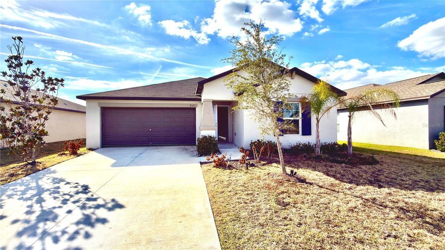 Welcome to 6523 Bar S Bar Trail in Zephyrhills a beautifully maintained 2023-built home that feels just like brand new. Freshly painted with brand new carpet throughout, this move-in ready property offers modern style, comfort, and functionality all in one.
This single-story home features a bright open-concept floor plan that seamlessly connects the living, dining, and kitchen areas, creating the perfect space for everyday living and entertaining. The kitchen is upgraded with granite countertops, stainless steel appliances including a BRAND NEW refrigerator and NEW stove, and plenty of cabinet and counter space for convenience and style.
The spacious owner’s suite offers a private bathroom and walk-in closet, while the additional bedrooms provide flexibility for family, guests, or a home office. With central heating and cooling, ceramic tile in main areas, plush new carpet in bedrooms, and a two-car garage, this home checks every box.
Step outside and enjoy one of the home’s most desirable features a beautiful pond view that creates a peaceful, resort-style atmosphere right in your backyard. The serene water backdrop offers privacy and relaxation, making it the perfect setting to design a future lanai, outdoor entertaining space, or even a custom pool. Whether enjoying morning coffee or unwinding in the evening, the view provides a refreshing and calming environment that truly elevates the home’s lifestyle appeal.
Conveniently located near Walmart, Starbucks, restaurants, shopping centers, and major roadways, everything you need is just minutes away.
If you’re looking for modern construction, quality finishes, scenic views, and true move-in ready condition, this is the one. Please call to schedule your private showing before it’s gone.