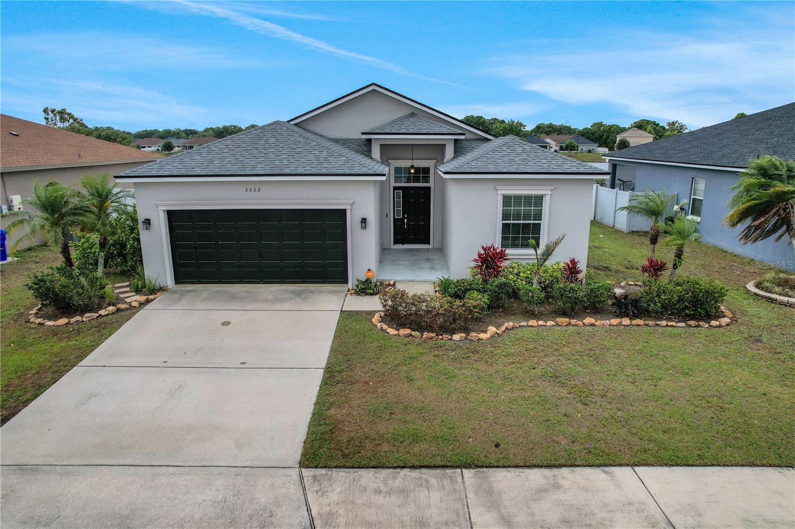 Waterfront Beauty in South Lakeland! This 2021 corporate owned 1,543 sq ft open floor plan home has split plan with 3 bedrooms/ 2 baths. High ceilings throughout the home, freshly painted in 2022, baseboards and new vinyl plank flooring, inside utility and French doors. The kitchen has Corian counters with breakfast bar overlooking the living room. appliances are newer refrigerator (2020), large sink (2021), disposal (2021), and dishwasher (2021). A spacious master bedroom has a ceiling fan, view of the lake, and leads to a master bath with separate shower and garden tub, plus walk-in closet. French doors open to screened patio with extra outside area for cookouts. New roof in 2021. The fenced back yard has automatic sprinklers. Family community with low HOA fees, playground for children, sidewalks and excellent southside location. Close to I-4, Polk Parkway and Lakeside Village Mall. Don’t miss this outstanding value! Call me Today!!