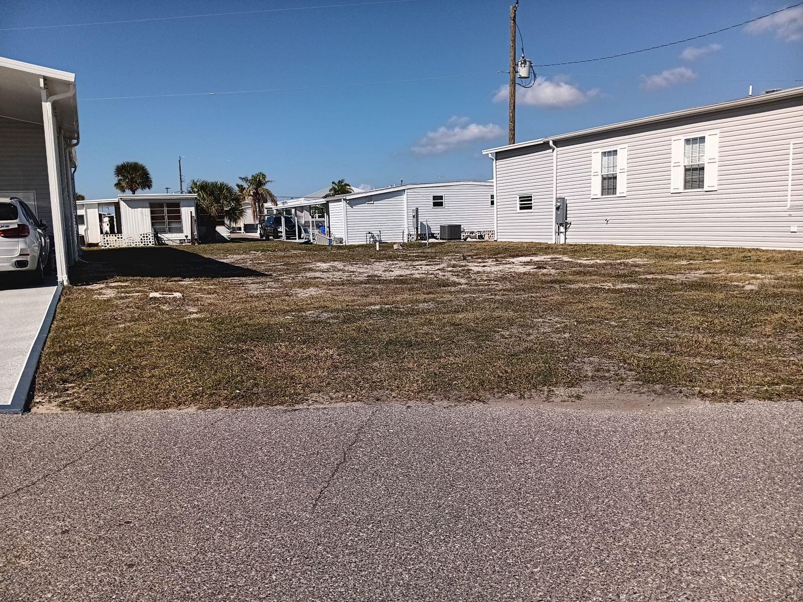 GREAT LOCATION FOR A NEW HOME IN COUNTRY CLUB ESTATES--CLOSE TO ENTRANCE, BIKE PATH, WALKING TRAIL, AND ALL OF THE WONDERFUL AMENITIES THAT THIS COMPLEX HAS . THE HOME HAS BEEN REMOVED AND THE LOT/SHARE IS READY FOR A NEW ONE AND PERHAPS A BOAT AS WELL. UP TO A 40' BOAT INCLUDING SAILBOATS CAN BE RENTED BY OWNERS. SURVEY AVAILABLE. TAKE A RIDE AND SEE IF THIS IS THE LOCATION FOR YOU. THIS BEAUTIUL COMMUNITY IS LOCATED ON VENICE ISLAND. ENJOY THE HEATED POOL WITH WATER AEROBICS AND EXERCISE CLASSES. CCE HAS TWO CLUBHOUSES, BOTH WITH KITCHENS, ONE CLUBHOUSE HAS A STAGE FOR BANDS AND PERFORMANCES, THE OTHER OVERLOOKS THE WATERWAY WITH RENTED BOAT SLIPS FOR THE RESIDENTS. FROM THE BOAT CLUB TO THE BOOK CLUB, YOU WILL PROBABLY FIND IT HERE. PICKLEBALL, SHUFFLEBOARD, CORN HOLE, BILIARDS, PING PONG. LIBRARY,FITNESS CENTER, MOST CARD GAMES, KARAOKE,EVENTS PLANNED FOR THE HOLIDAY, LOCAL BANDS AND DJ;S FOR DANCES, NEIGHBORHOOD PARADES AND SCAVENGER HUNTS. THIS IS A LIFESTYLE, NOT JUST A PLACE TO LIVE--COME SEE FOR YOURSELF.