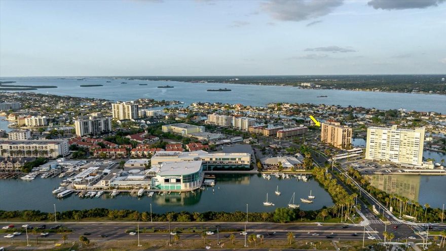 Experience true resort-style living in this beautifully renovated 2-bedroom, 2-bath condo located in the highly sought-after Island Estates community on Clearwater Beach. Offered fully turnkey and move-in ready, this stunning 8th-floor residence showcases breathtaking sunset views from an expansive private balcony accessible from both the living room and bedroom. The open-concept design features a modernized kitchen flowing seamlessly into a spacious living area, complemented by elegant luxury vinyl flooring throughout. Fully remodeled in 2021, the unit blends comfort and style in one of the area’s premier waterfront buildings.

Residents enjoy a secure lobby entrance and an impressive lineup of amenities, including a heated waterfront pool and spa, newly updated his-and-her saunas with changing rooms, and a Tiki bar with a large TV—perfect for entertaining. Stay active with tennis, pickleball, and shuffleboard courts, or take advantage of kayak launches, a floating dock, and available boat slips offered at just $60/month (first come, first served). Additional conveniences include BBQ areas, kayak and bike storage, and laundry facilities on every floor.

The HOA covers cable, Wi-Fi, water, sewer, trash, building insurance, reserves, meticulously maintained grounds, and on-site management—providing true maintenance-free living.

Location is a standout feature, with easy access to everything Clearwater Beach has to offer. Walk, bike, or hop on the Jolley Trolley to reach Pier 60 just half a mile away. Island Estates is a vibrant, self-contained community featuring local favorites like Island Way Grill, Publix, banks, dining, shopping, and the Clearwater Marine Aquarium—all just steps from your door.

Whether you're searching for a full-time residence, vacation getaway, or investment opportunity, this exceptional condo delivers the ultimate coastal lifestyle. Don’t miss your chance to own a piece of paradise—schedule your private showing today!