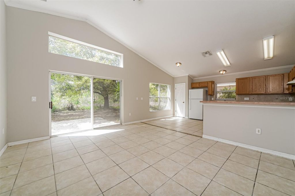 Photo of 948 Chanler Drive, Haines City, FL 33844 (MLS # O6393676)