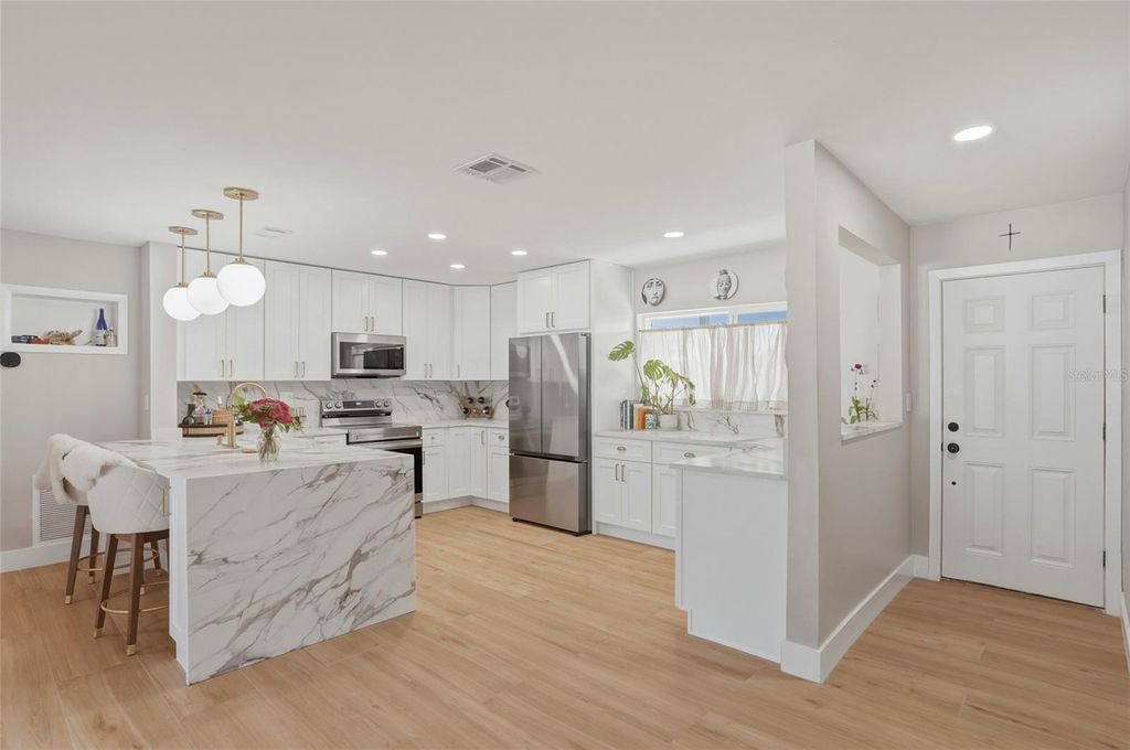 Photo of 411 42nd Avenue NE, St Petersburg, FL 33703 (MLS # TB8503079)