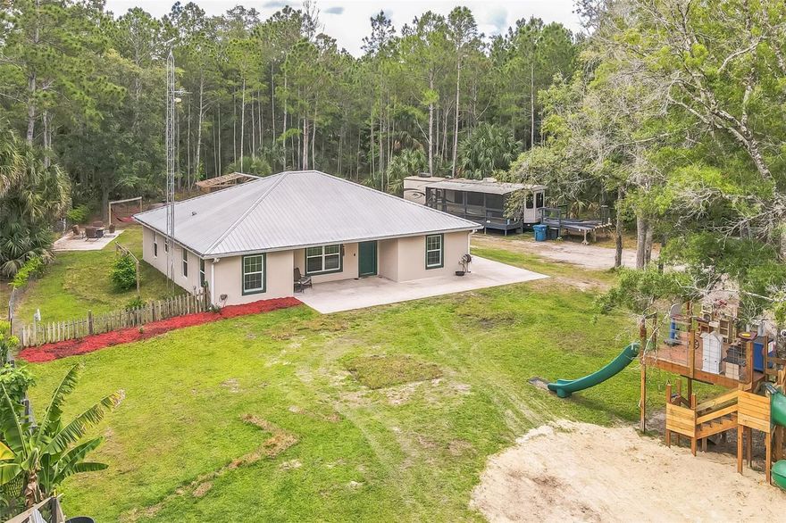 Away from it all, but in the middle of it all"

Well thought out floor plan with PLENTY of room to expand.  3/2 block home, metal roof, less than 10 years old, on 10 acres, fenced, LOTS of storage.
Less than 45 minutes from Daytona & New Smyrna beaches, speedways, and entertainment.
20 minutes from the Sanford airport.
About an hour away from downtown Orlando, Disney, Sea World, Universal theme parks.