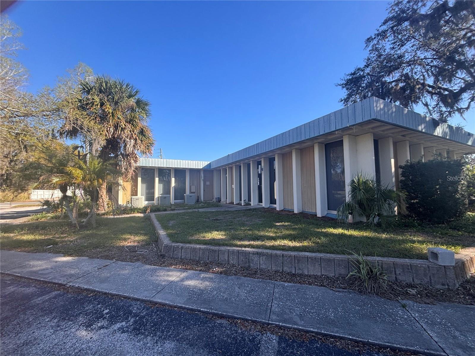 Office building in downtown Kissimmee. Total of 8 exam rooms or offices, 3 bathrooms, and a huge Atrium that could be used for a multitude of things. Comes complete with at least 30 parking places not including street parking. Centrally located to downtown business, hospital and major road ways. Most floors have laminate flooring. This unit has multiple entrances including a handicap ramp. Possibility to have 3 business with 2 reception area's and 3 different entrances.