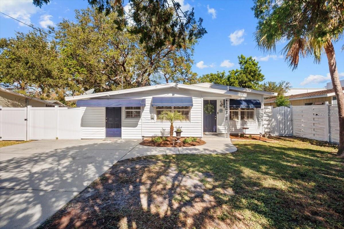 Charming cottage style home located on the edge of downtown in a neighborhood of multimillion dollar new construction, fourteen minutes to St. Armands Circle and Lido Beach, walking distance to beautiful Payne Park, Publix, Legacy Trail Alta Vista School & Sarasota High School. House has lots of green space just under a quarter acre with a completely fenced in backyard that offers endless entertaining possibilities to make it your own, back of house has a pocketed glass slider to completely open up house to backyard. Completely remodeled kitchen, appliances and bathroom mid 2020 new AC 2024 new roof with all new decking completed 4/2025 house has double hung windows with interior plantation shutter window treatments adding to the old Florida charm, has stayed high & dry and undamaged though all storms in the 22 years of ownership has an excellent consistent rental history, If you're looking for a darling, unique, remodeled house with some original features left intact don't pass this one by.