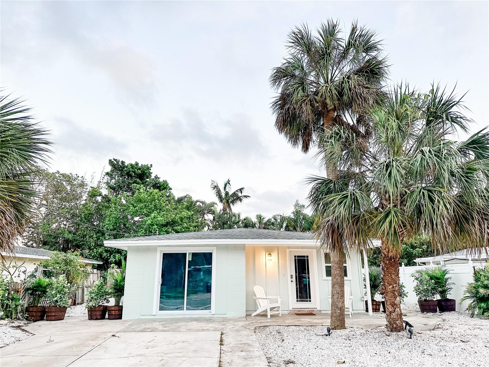 Fully remodeled home located in the heart of Long Beach Village at the north end of Longboat Key. Short walk to the beach and several top rated restaurants on the island. From top to bottom, inside and out, nearly everything about this property has been updated. New luxury vinyl plank flooring throughout the house in every room. From the front door, the family room opens up into the kitchen to allow for an open floorplan which is great for hosting guests and family. The kitchen has been completely remodeled with new cabinets, all new appliances (refrigerator, oven & stove, mini wine refrigerator, microwave, and garbage disposal), new island/bar, and new marble countertops. All windows have been updated to impact resistant windows rate at Miami-Dade standards. All new interior paint throughout each room and closet and all new exterior paint around the house. A new laundry room was installed with all new washer, new dryer, and new water heater. The front room was converted into a 4th bedroom with a closet and impact resistant sliding glass doors. Both the master bathroom and 2nd bathroom have been completely remodeled with new stone shower flooring, new tiles for the walls, updated sinks and toilets. From the master bedroom, a new impact resistant sliding glass door was installed which leads to the spacious backyard. A new screened in, enclosed porch wraps around the back of the house and overlooks an outdoor fire pit. The exterior also includes a grill, storage for your beach gear, and outdoor shower to rinse off from the beach. The roof is in excellent shape with new insulation added to the attic to improve the efficiency of keeping the home cool in the summer and warm in the winter. The air conditioning unit has been updated with a new motor and replaced most of the duct work. This is a unique opportunity to own a move in ready, beautifully remodeled home in a highly sought after beach community on Longboat Key.