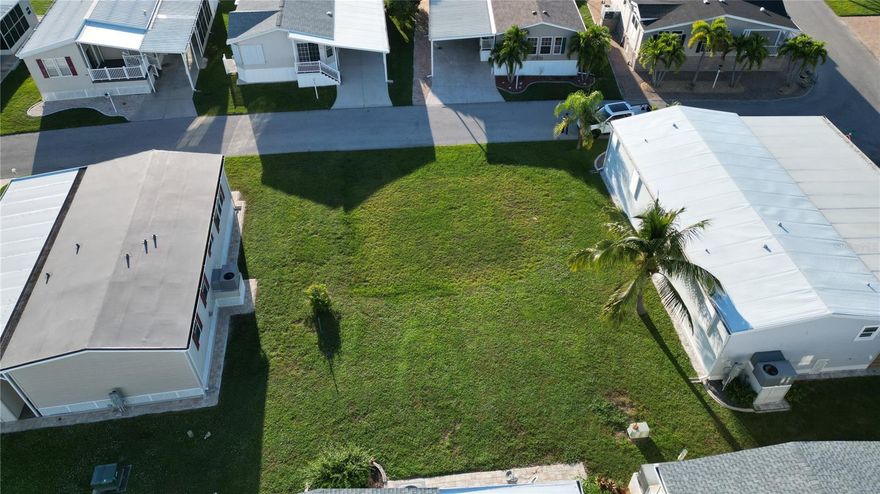 Discover the perfect spot for your custom manufactured home in the highly sought-after 55+ community of Windmill Village!
This vacant lot is already cleared and leveled—ready for you to bring your vision to life. Enjoy a carefree lifestyle with a low monthly HOA fees, which covers water, sewer, trash, and common area upkeep. Windmill Village offers a vibrant, active atmosphere with outstanding amenities, including two private marinas, a boat ramp, shuffleboard, bocce ball, billiards, pickleball, and a spacious community center with a variety of hobby clubs. Relax or host gatherings at The Pavilion beside the heated pool, the perfect place to socialize and unwind.