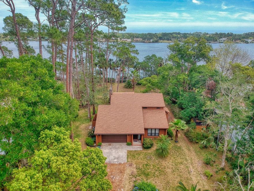 Direct Waterfront home on Beautiful Turnbull Bay with access to the Intercoastal Waterway.  Enjoy a day on the water, tie up your boat to your own private dock and fire up the grill.  Enjoy ocean bay breezes on over an acre of land and moonrises with that favorite beverage. A nature lovers dream for small craft boating, fishing or sunrise watching. Plant that garden you have always dreamed about.  A/C units replaced in 2019, double pane windows, outside private shower, covered porch, screened balcony, extensive insulation in attic, newer electrical panel, fireproof drywall (type c), fiberglass insulation in walls, well, 100 foot dock with boat house with two boat lifts,  Maybe a fixer upper or use "as is".  A great spot to live and/or build your forever home and live the waterfront dream.   Property is 10 minutes away from the beach, Flagler Ave and Canal Street.  Its about LOCATION!!! AWESOME OPPORTUNITY to own a waterfront property !! ;Water: City