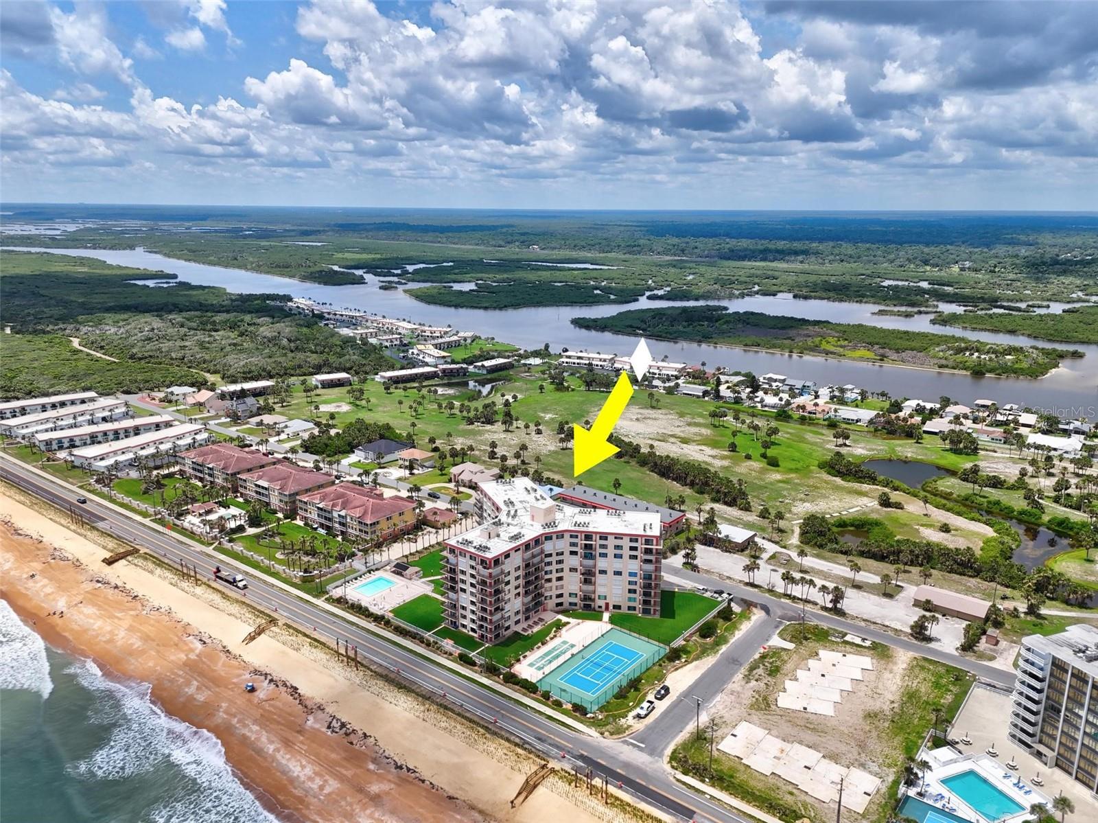 Paradise awaits in Flagler Beach! Located in between St. Augustine and Daytona Beach, Flagler Beach offers the small home town feel with plenty to offer. This 2 bedroom, 2 bathroom end unit has a wrap around porch with views of the ocean and incredible sunrise and sunset views. The open floor plan creates plenty of space for living and dining. Each bedroom is spacious and offers large closets. The guest bathroom has been newly remodeled. Two storage spaces are included, one directly outside of the unit and one at ground level. New hurricane resistant windows and sliders were installed in 2019. Other features include: washer/Dryer in unit, one assigned parking spot underground, fitness center, pool and pickle ball/tennis facility. Monthly dues include Internet, cable, water, trash, sewer, building insurance and building maintenance. Walk to the beach or the 9 hole golf course that is seen from your balcony. This unit comes fully furnished and ready for you to come live the Florida beach lifestyle! *Minimum lease is 6 months*