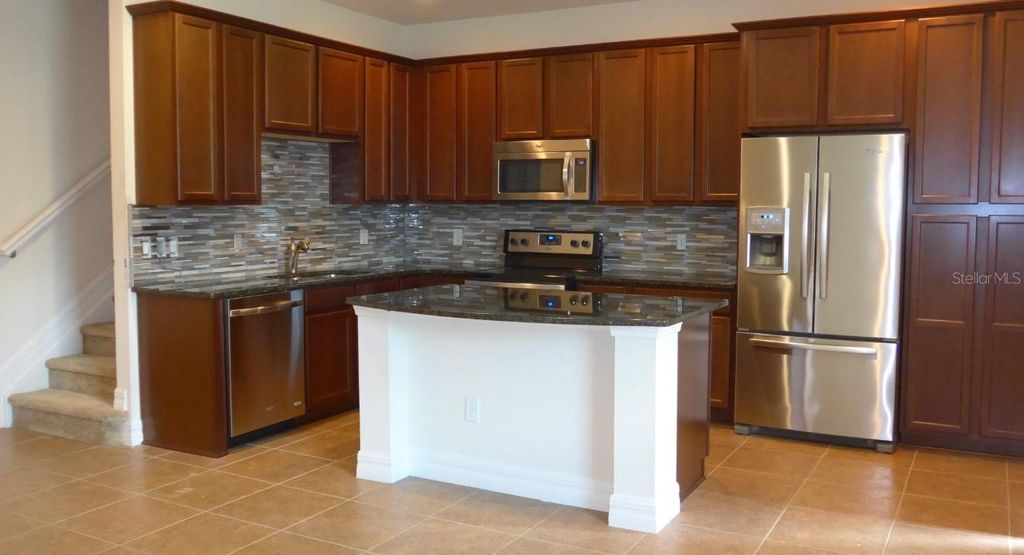 Photo of 10005 Eagle Creek Center Boulevard, Orlando, FL 32832 (MLS # O6366741)