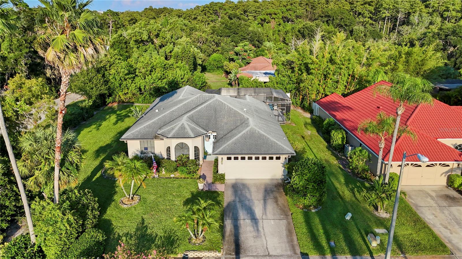Welcome to 1603 Polo Club Drive, a beautifully maintained 4-bedroom, 3-bathroom pool home in the highly desirable community of Harbour Woods North in Tarpon Springs. Perfectly designed for comfort, privacy, and entertaining, this residence offers a rare triple-split floor plan that ensures every member of the household has their own space while still providing inviting common areas to gather.
Step inside to find a spacious open layout with vaulted ceilings and an effortless flow between the living, dining, and kitchen areas. The heart of the home is its seamless indoor-outdoor connection, where expansive sliding glass doors open to the screened-in lanai and sparkling pool with spa. This tranquil retreat is complete with a pool deck, a new pool/spa electric heater, and a salt chlorine generator, making it ideal for year-round enjoyment and entertaining guests.
The split floor plan is truly a dream. The primary suite is a private retreat featuring a walk-in closet with custom built-ins, a soaking tub, and a walk-in shower. Two additional bedrooms share a guest bath in one wing, while the third bedroom offers its own private suite with pocket door separation—perfect for in-laws, visiting family, or even a live-in au pair.
The kitchen boasts beautiful cabinetry, granite countertops, stainless steel appliances, and an adjacent breakfast nook with views of the backyard greenery. Updates throughout the home provide peace of mind, including a new electrical panel, water heater (2020), washer and dryer (2022), new air conditioner (2024), new garbage disposal (2024), and a recently installed backyard privacy fence.
Outdoors, lush landscaping and a manicured lawn create inviting curb appeal. The two-car garage and long driveway provide ample parking.
Beyond the home, the location is unbeatable. Just minutes away are the world-famous Tarpon Springs Sponge Docks, offering unique shopping, dining, and cultural experiences. Downtown Tarpon Springs is equally close, with its vibrant mix of restaurants, breweries, and entertainment. Nature lovers will appreciate being less than a mile from the Gulf, 1.2 miles from Sunset Beach, and 1.8 miles from Fred Howard Park and Beach. Top-rated hospitals, schools, and everyday conveniences are all nearby, making this home as practical as it is beautiful.
Whether you’re relaxing in your private pool, hosting family and friends, or exploring the charm of Tarpon Springs, this property offers the perfect balance of functionality, style, and Florida lifestyle.
Don’t miss the opportunity to make 1603 Polo Club Drive your new home—schedule a private showing today!