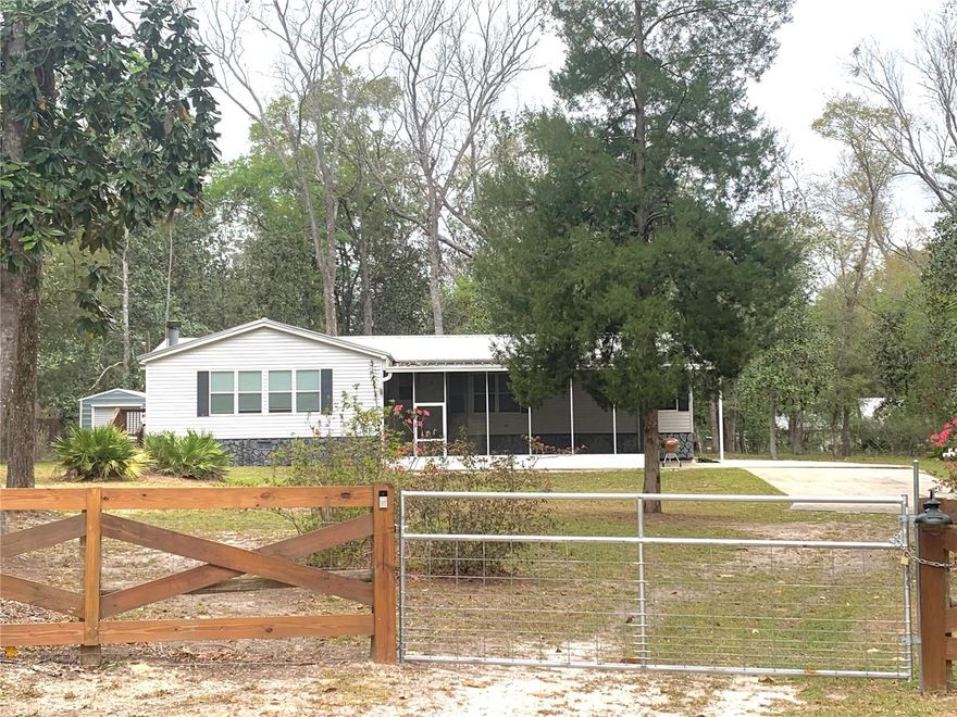 Don’t miss this fantastic opportunity to own a spacious 3-bedroom, 2-bath home offering 1,959 square feet, located in the peaceful and desirable Deere River Estate subdivision. Nestled in a quiet neighborhood, this property provides the perfect blend of comfort, space, and natural surroundings. Situated on a concrete slab and fully fenced, the home overlooks neighboring woods—giving you a front-row seat to local wildlife and serene views. The split floor plan features generously sized bedrooms and an open, airy layout ideal for both everyday living and entertaining. Enjoy relaxing or hosting guests on the oversized screened-in front porch, a true highlight of the home. Inside, the wide-open kitchen boasts tons of cabinet space, stainless steel appliances and flows seamlessly into the main living areas. The large family room features a cozy wood-burning fireplace, perfect for gathering with family and friends. Additional features include a Saltwater treatment system, 50-amp RV hookup, inside laundry room with washer, dryer, and utility tub, Newer 10’ x 12’ storage shed, High-speed Wi-Fi availability. Conveniently located just minutes from Manatee Springs State Park and Chiefland Golf and Country Club, and only a short drive to shopping, dining, and everyday essentials. This property offers the perfect combination of space, location, and lifestyle—schedule your showing today!