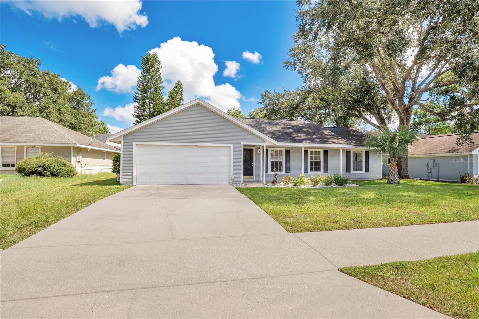 Charming 3-Bedroom Ranch in Sought-After Alafaya Woods. Welcome to this spacious and well-maintained 3-bedroom, 2 bath ranch-style home nestled in the highly desirable Alafay Woods neighborhood. Offering 1,700 square feet of comfortable living space, this home is located on a cul-de-sac in a top-rated school district - perfect for families seeking convenience and community. Inisde, you'll find a large living room ideal for entertaining, a separate dining room for family meals, and a formal living room that offers flexible space for a home office, playroom, or sitting area. The galley kitchen provides efficient functionality with easy access ot the dining area. The generously sized primary suite features an en suite bathroom for your private retreat. Two additional bedrooms and a full bath complete the thoughtful layout. Step outside to enjoy the expansive backyard and screened-in back porch - perfect for relaxing or entertaining year-round. Additional hightlights include a two-car garage, mature landscaping, and close proximity to shopping, dining, parks and major highways. Don't miss this opportunity to own a beautiful home in one of Oviedo's most desirable neighborhoods!